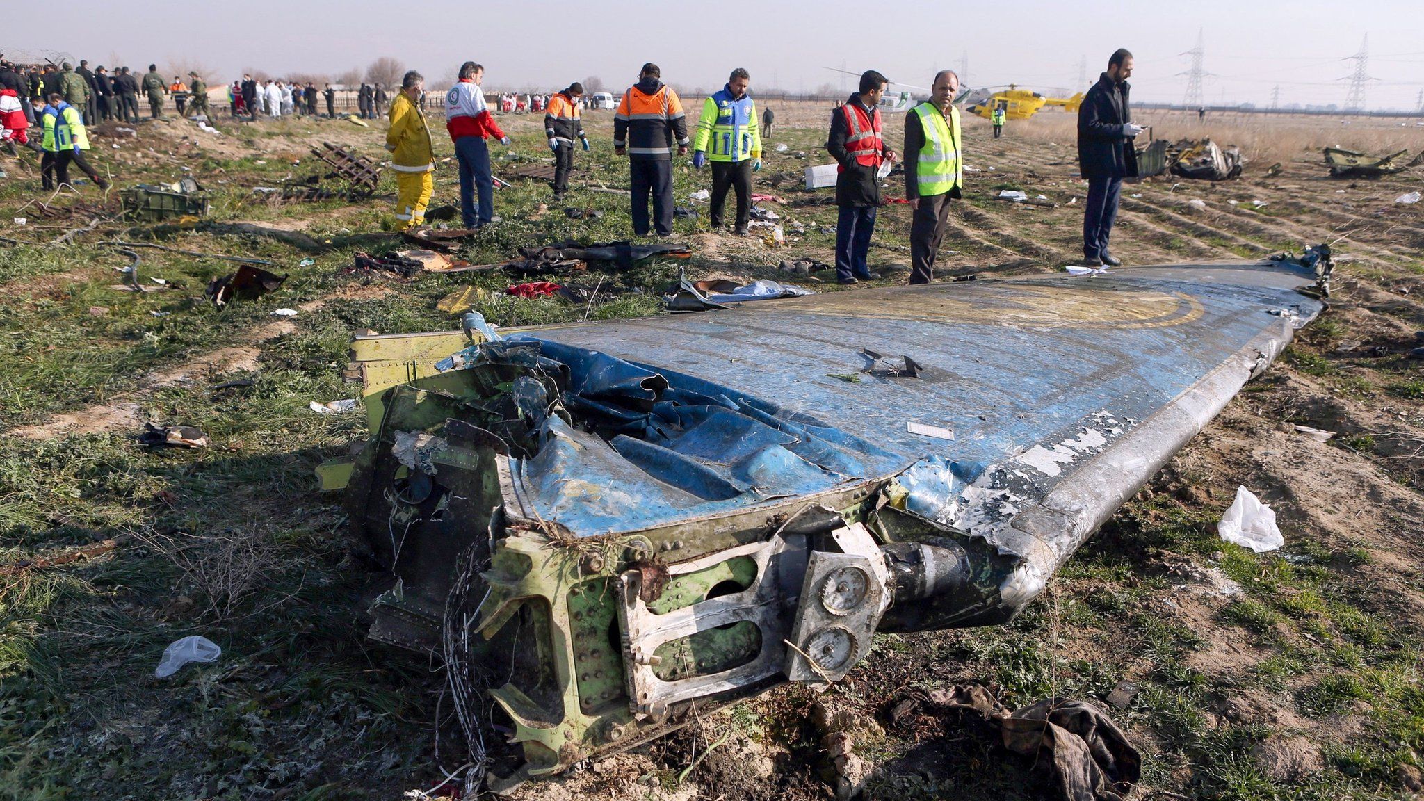 Rescue teams inspect the wreckage of Ukrainian International Airlines flight PS752