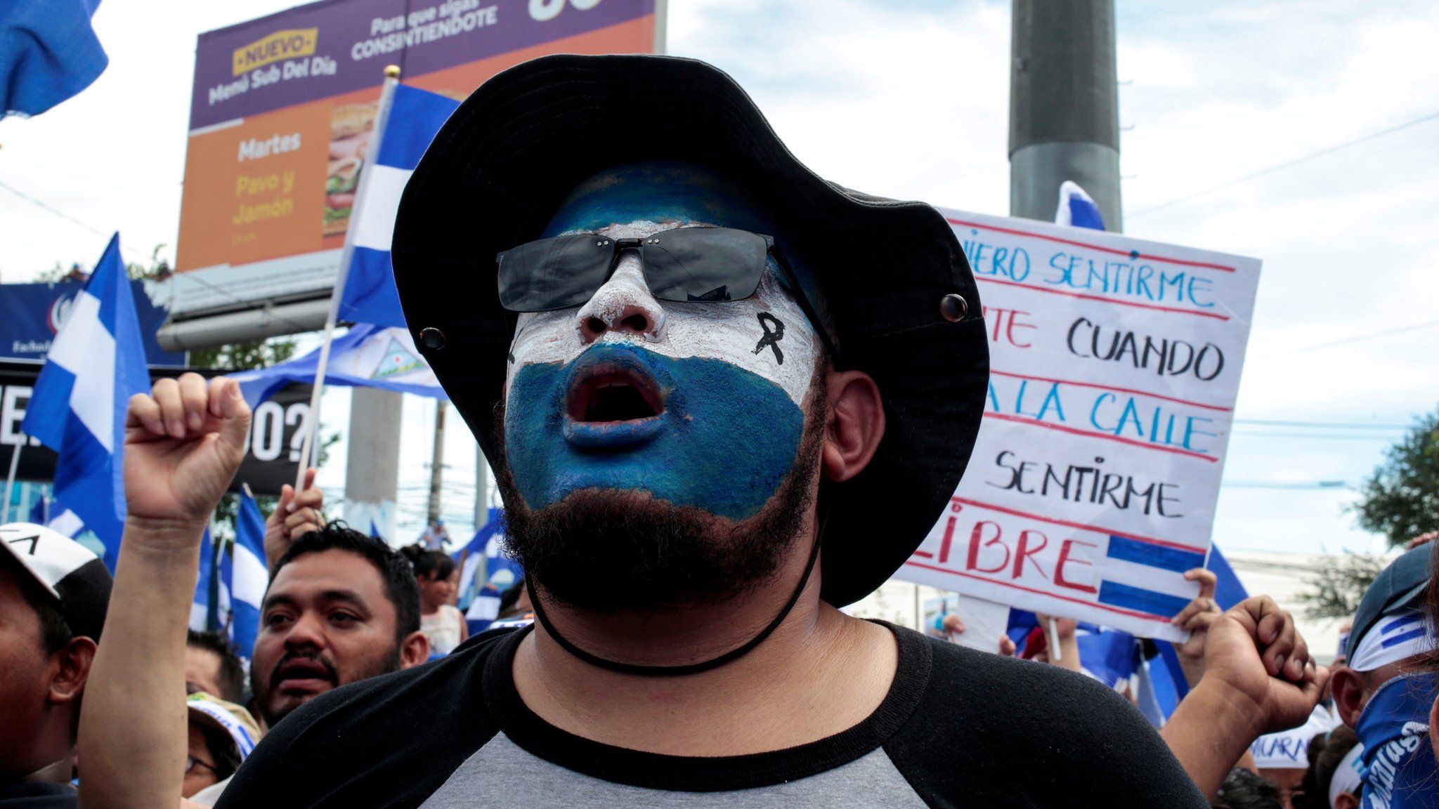 A demonstrator with the colours of the national flag painted on her face takes part in a protest against Nicaraguan President Daniel Ortega's government in Managua, Nicaragua May 30, 2018