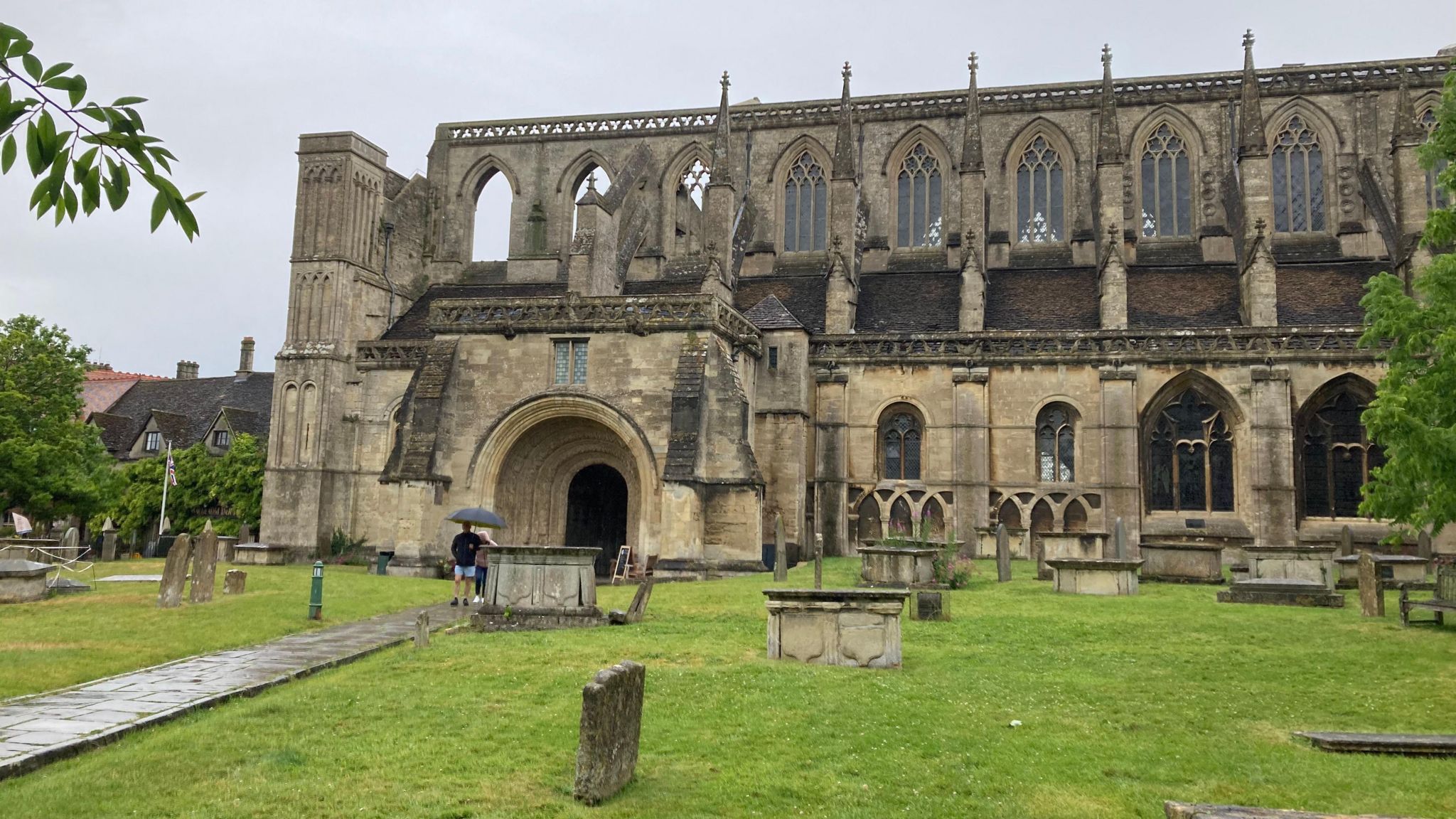 Malmesbury Abbey under a grey sky