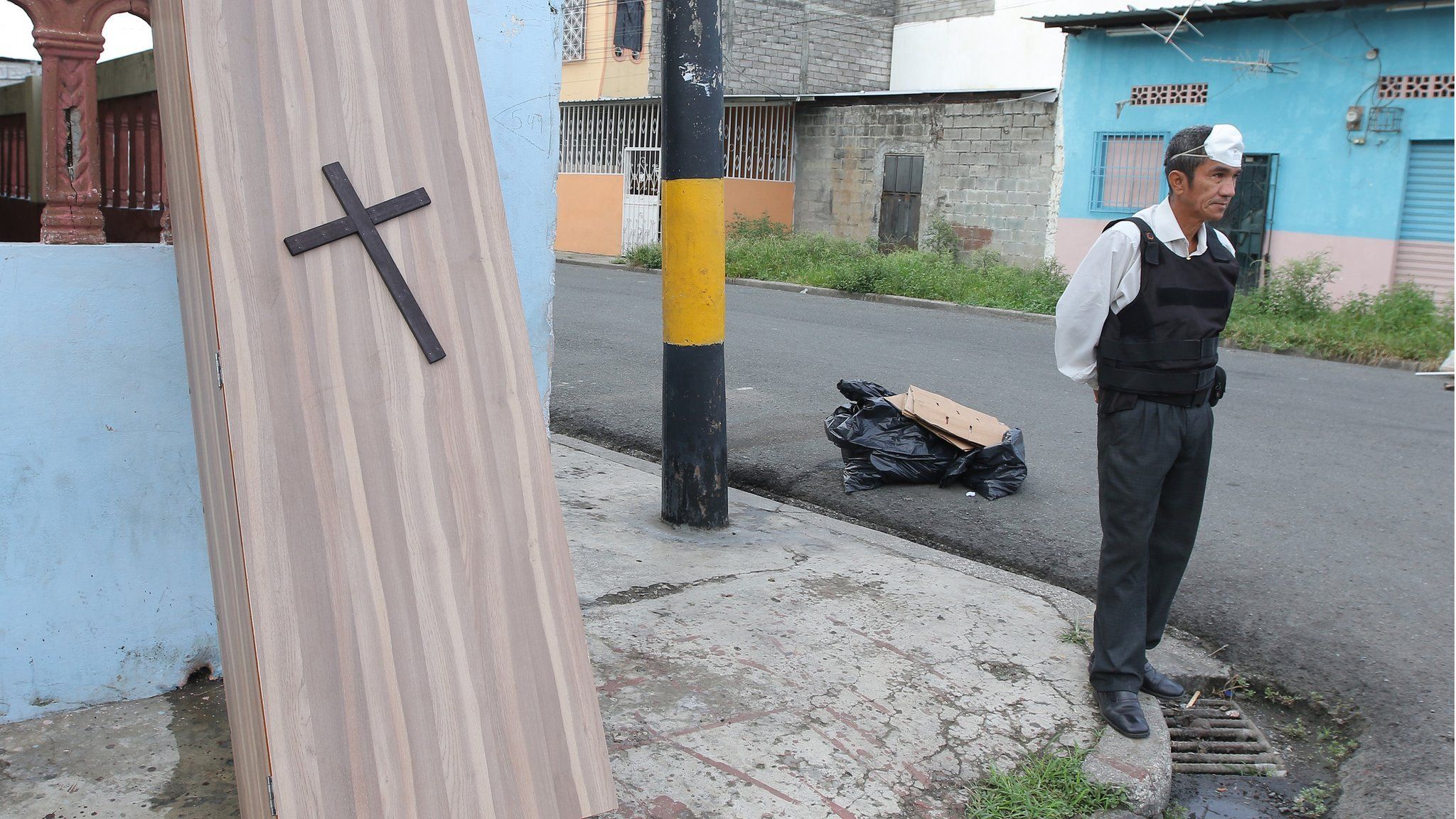 A man sells caskets on 29th Street and Oriente, a suburb of Guayaqui