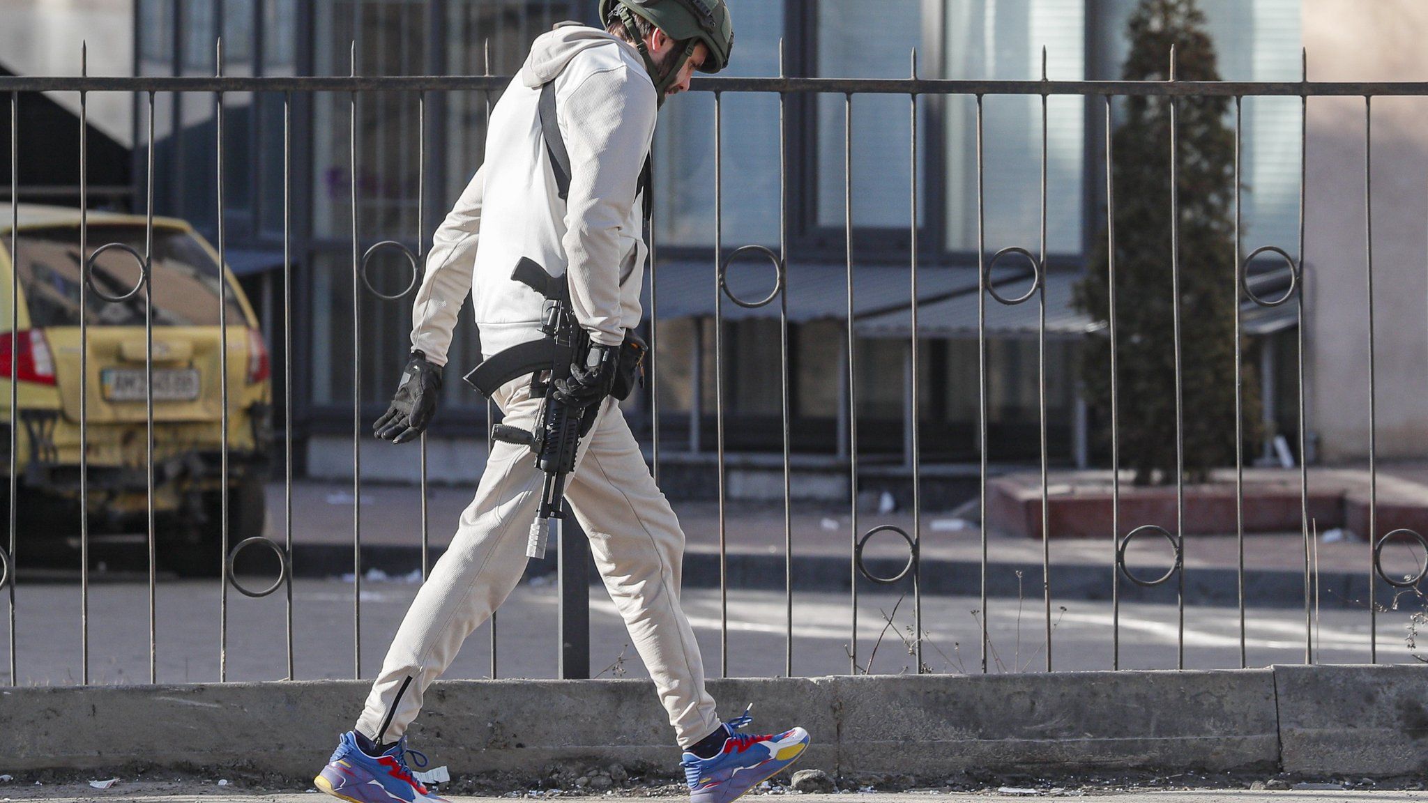 A member of the Territorial Defence Forces of Ukraine walks on the street in Kiev, Ukraine, 26 February 2022