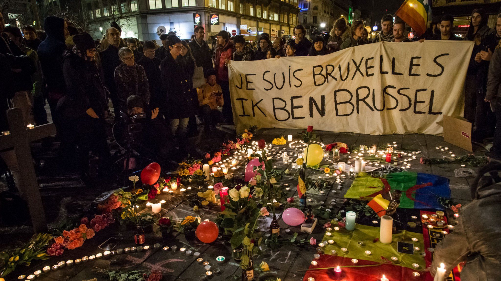 Floral tributes, candles and flags in front of the Place de la Bourse on March 22, 2016