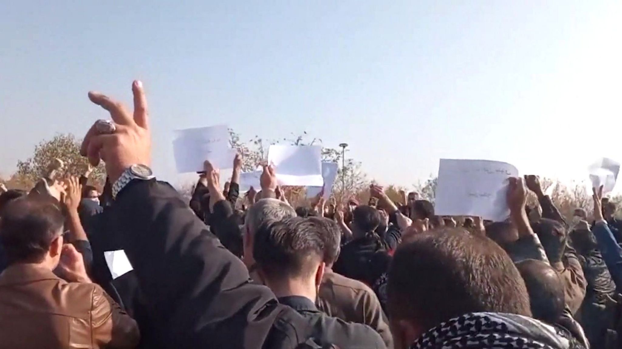 Screengrab of video posted by Kurdish quality  rights radical  Hengaw, purportedly showing a assemblage  protesting astatine  the cemetery successful  Saqqez, Iran, wherever  Mahsa Amini is buried (26 October 2022)