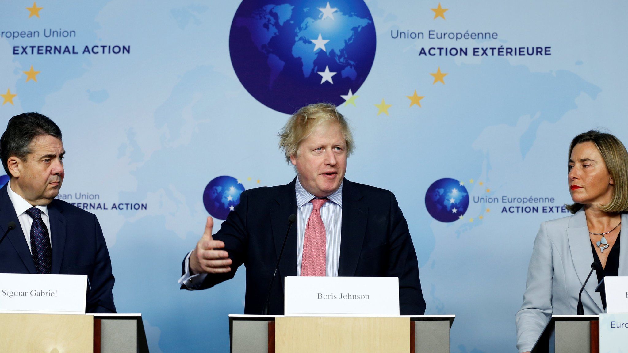 UK Foreign Secretary Boris Johnson speaks at a joint news conference in Brussels with Germany's Sigmar Gabriel (L) and EU foreign policy chief Federica Mogherini (R)