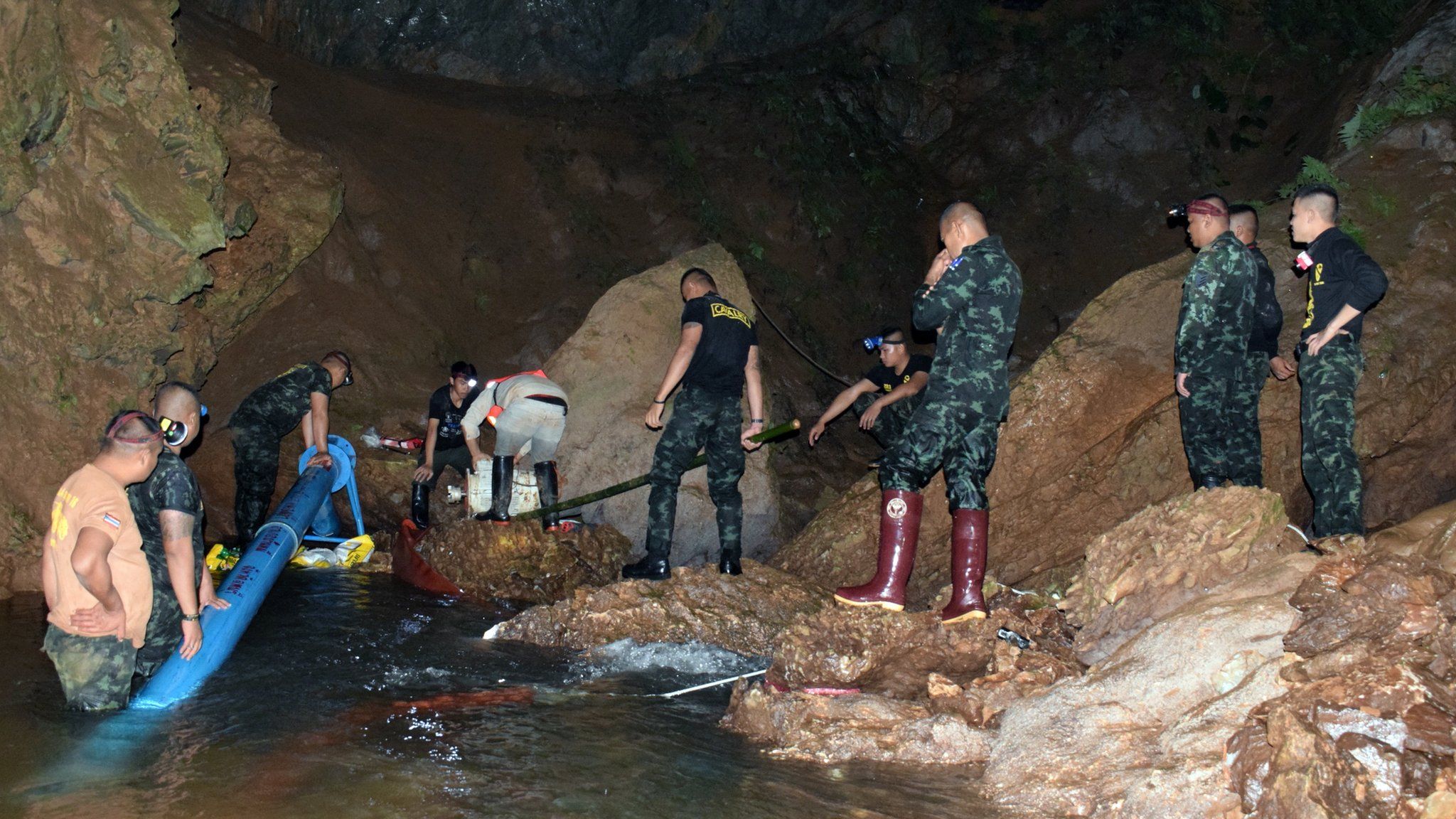 Thai soldiers pumping flooded water out of the cave complex during a rescue operation