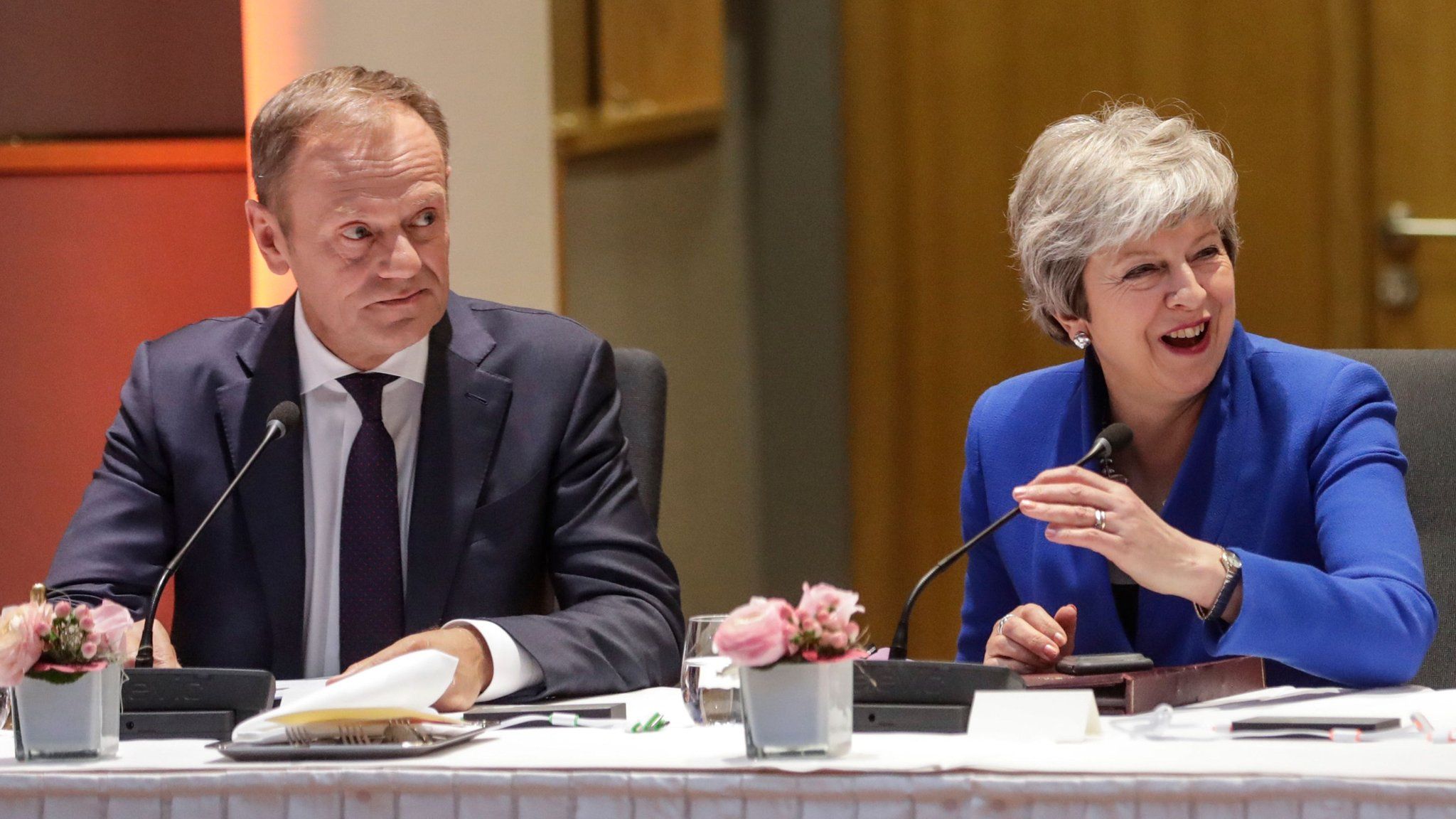 European Council President Donald Tusk (L) and Britain"s Prime Minister Theresa May look on during a European Council meeting on Brexit