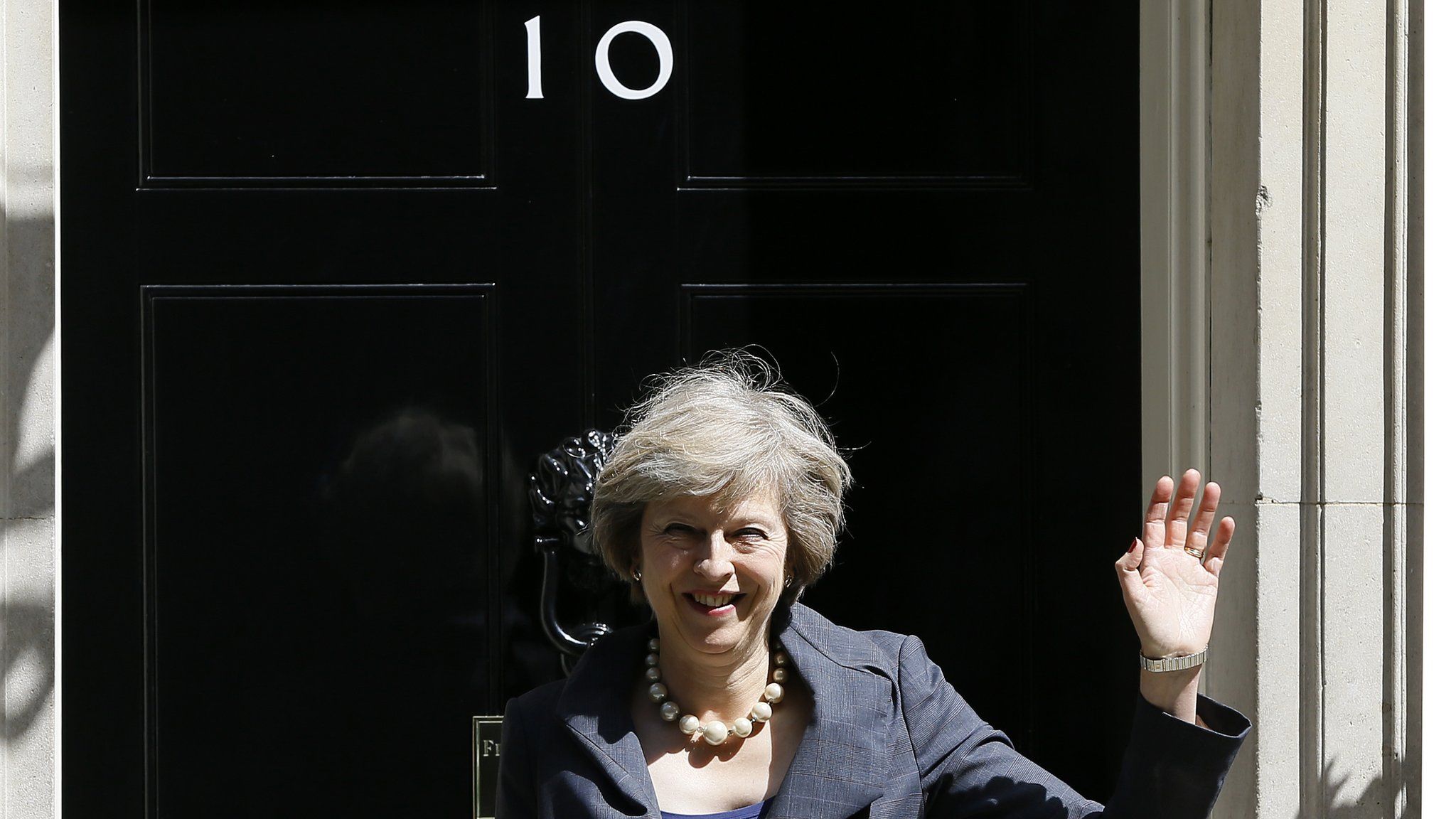 Theresa May waving outside No 10