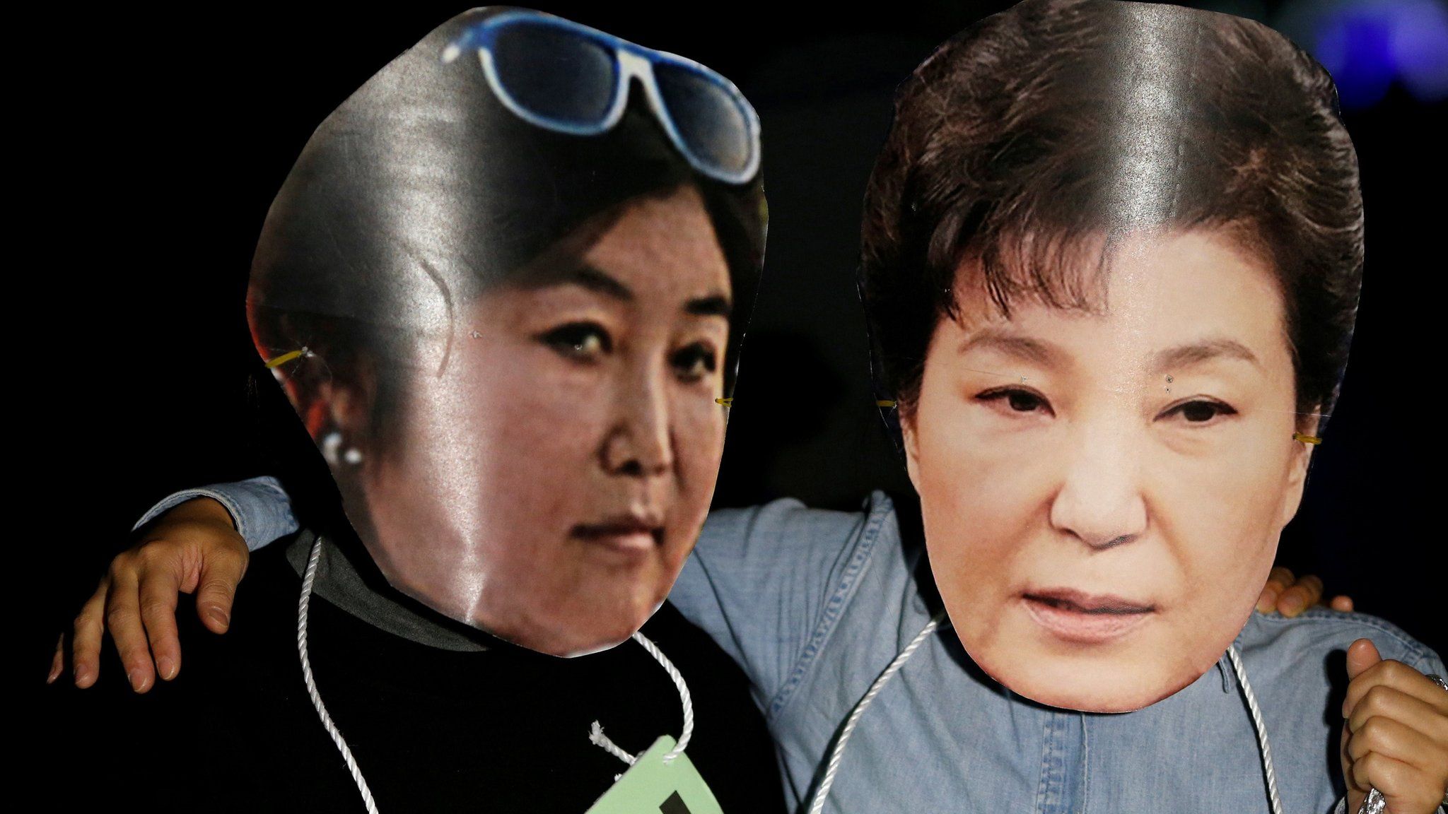 Protesters wearing cut-outs of South Korean President Park Geun-hye (R) and Choi Soon-sil attend a protest - October 27