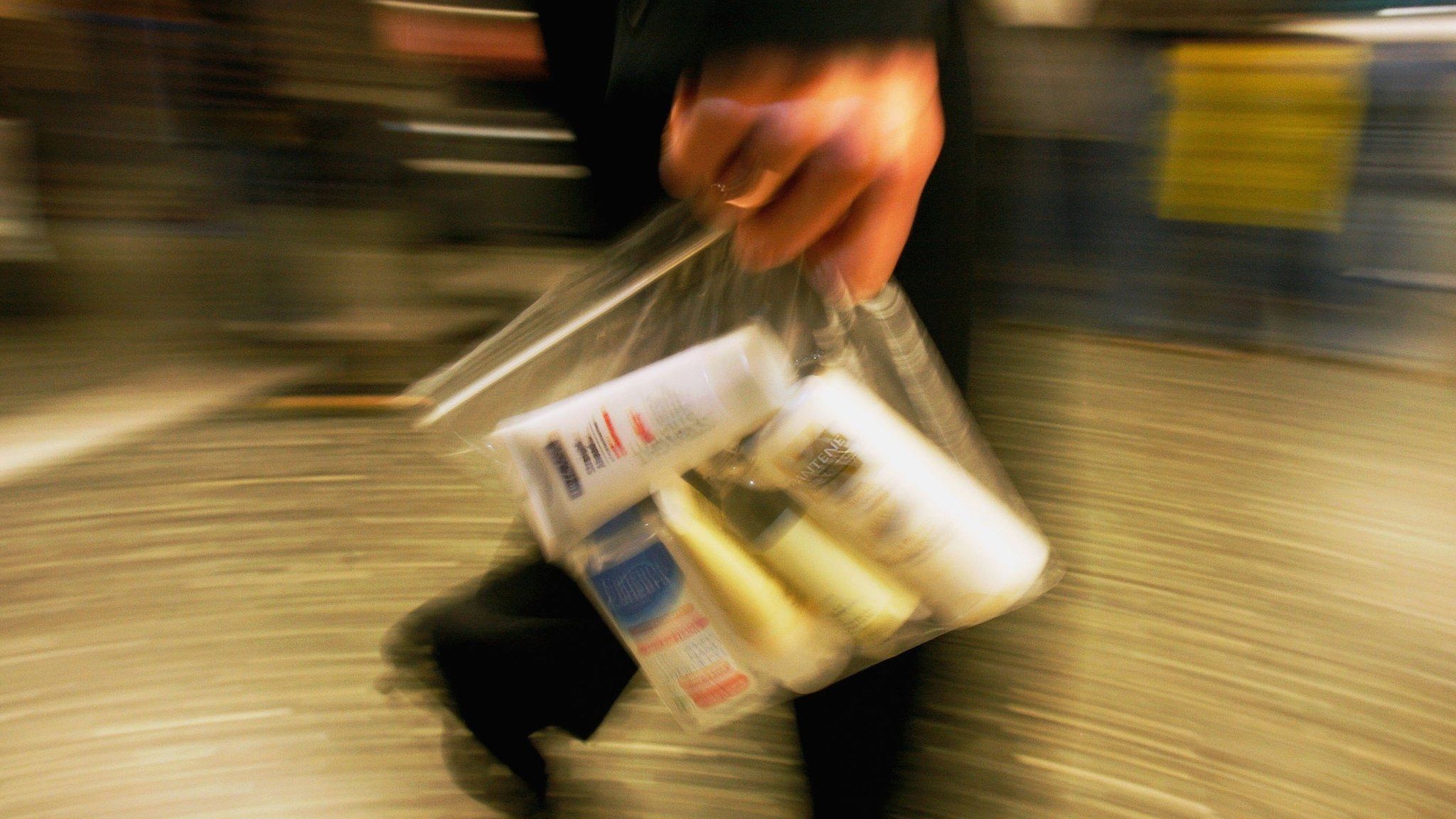 Air traveller with liquids in plastic bag