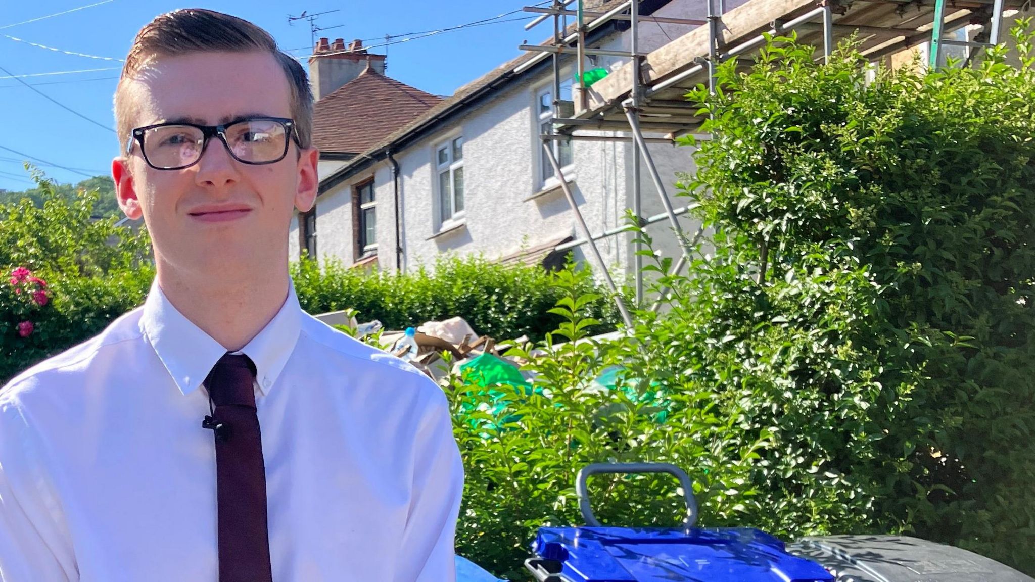 Jacob Riddle, who has started a petition on the bins problem, standing outside homes