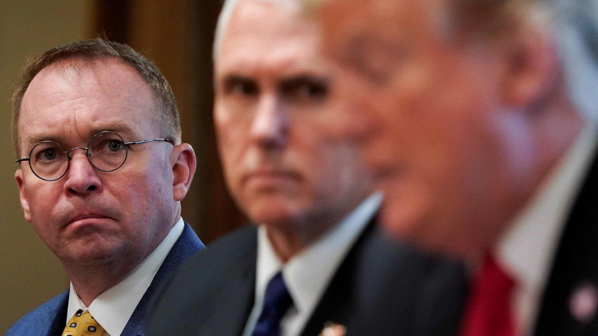 Mick Mulvaney, Mike Pence and Donald Trump
