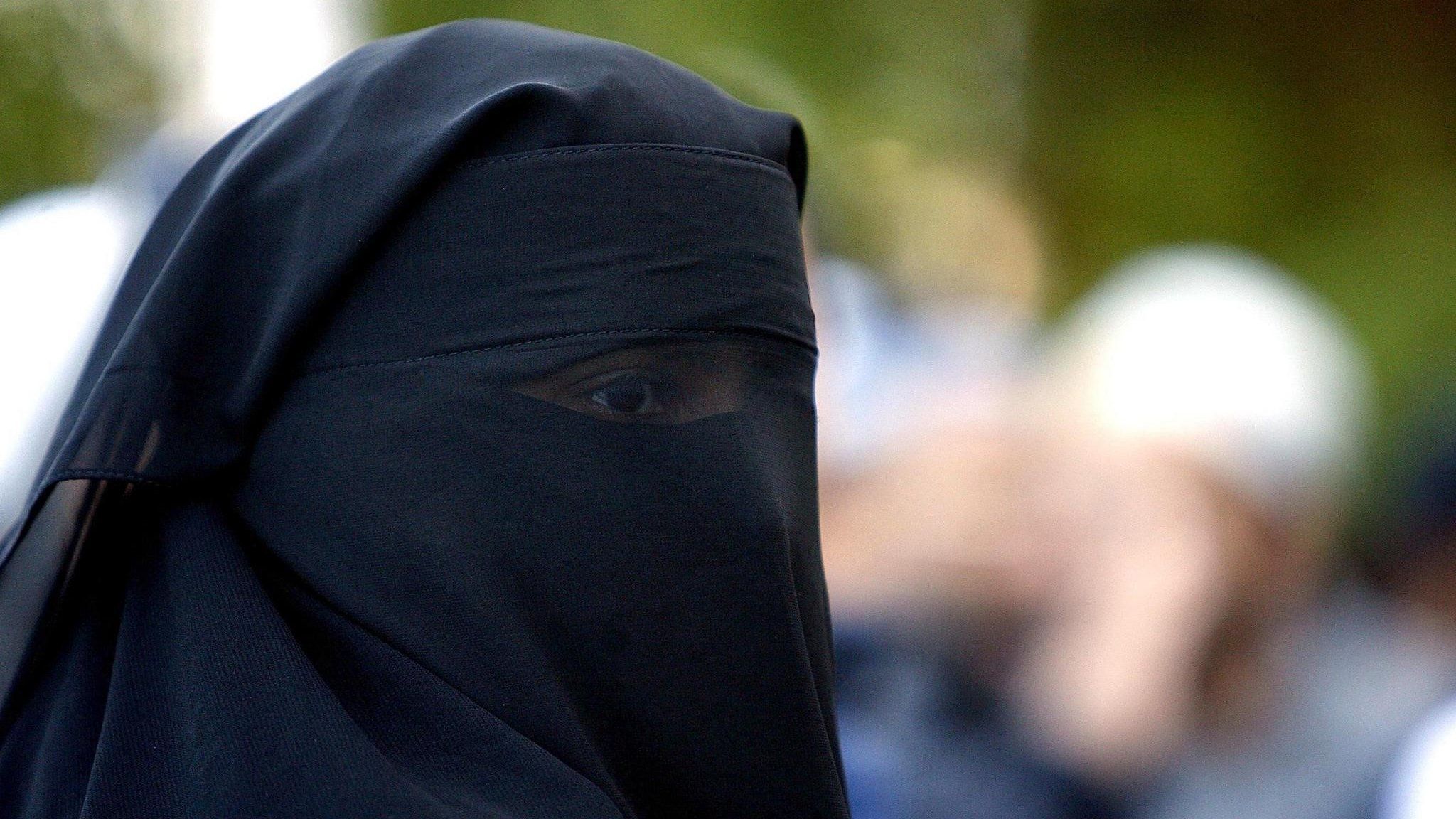 A Muslim woman with a face veil