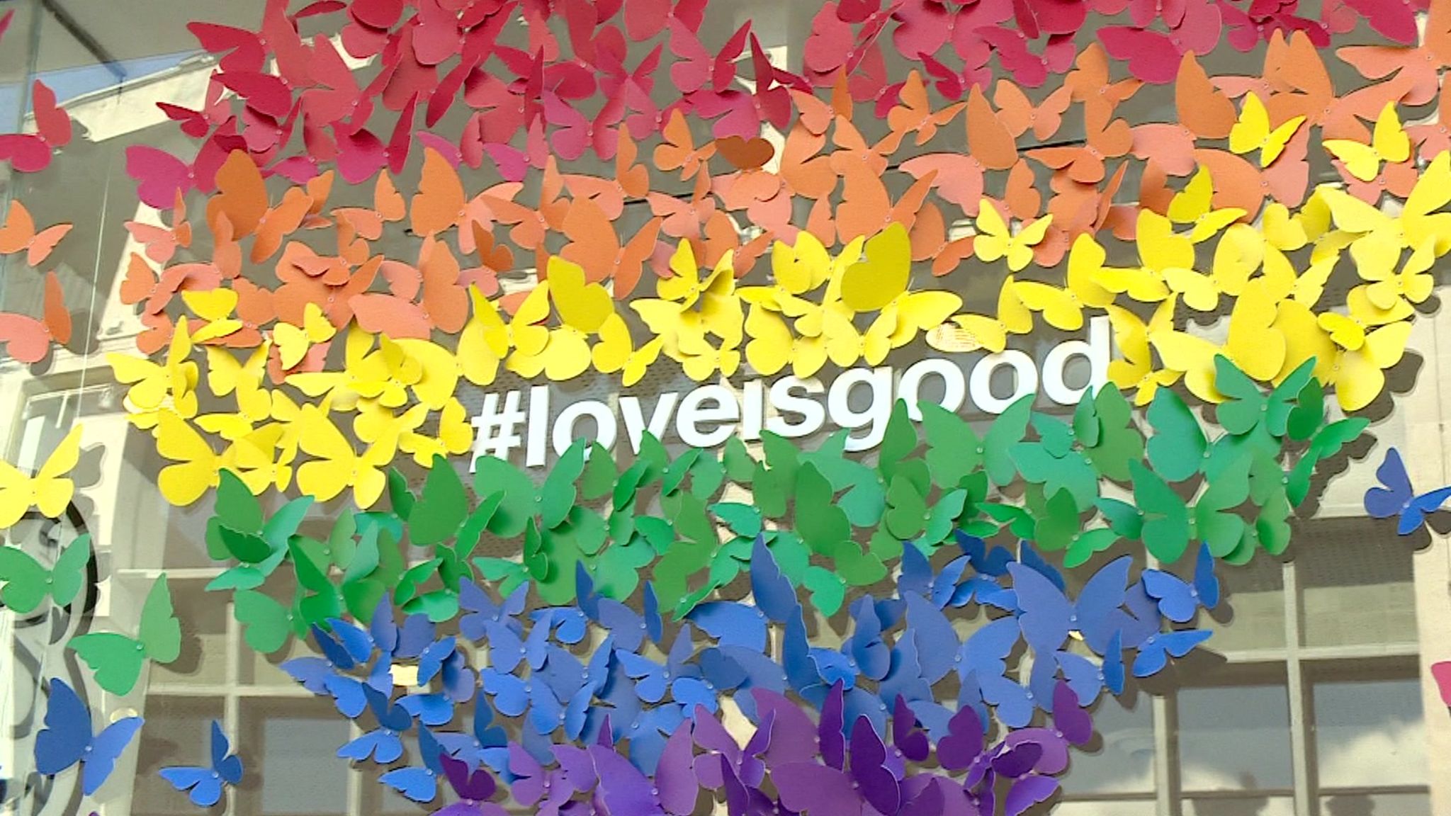 Pride inspired display with #loveisgood multi-coloured butterfly designed rainbow heart