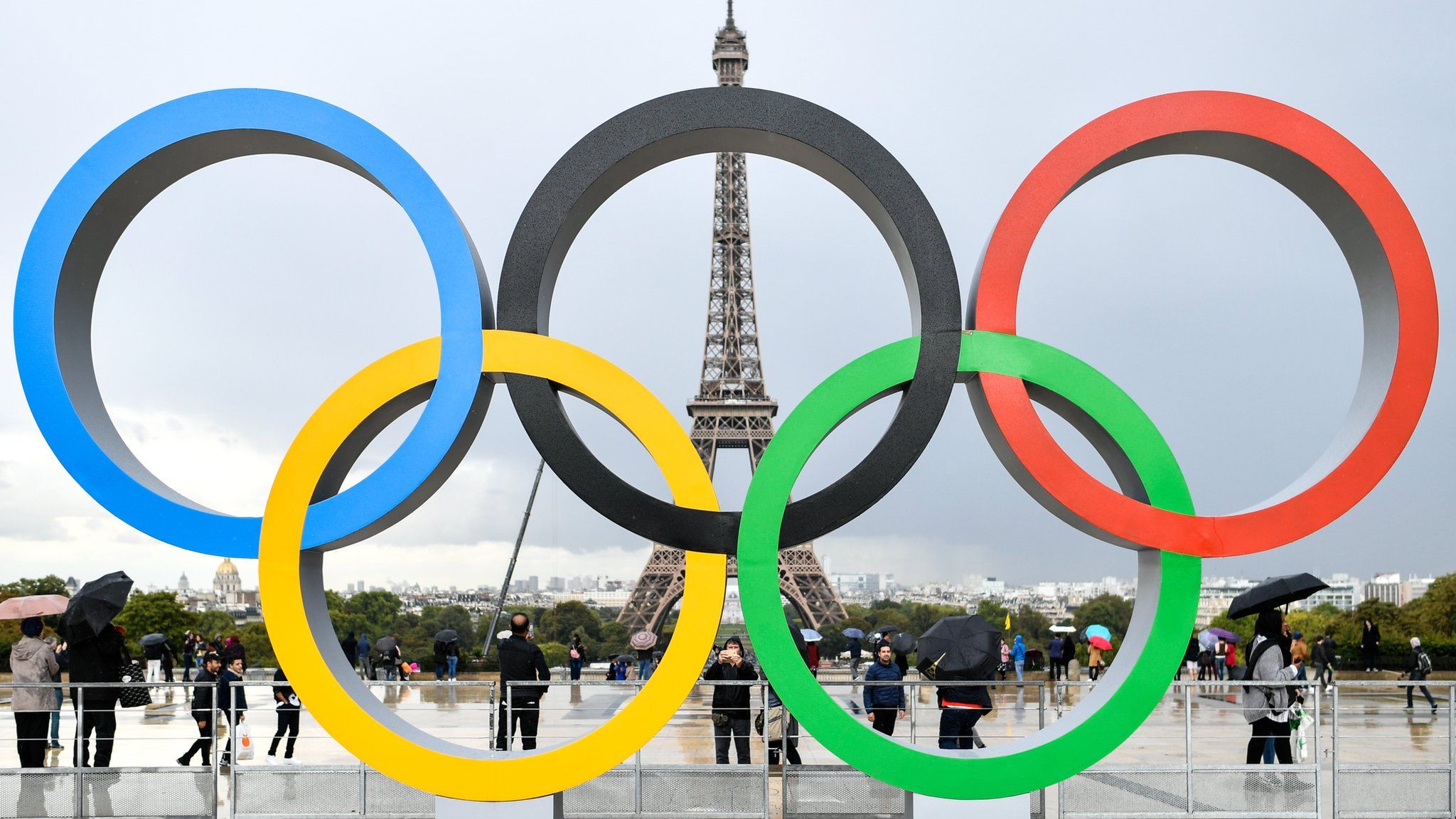 Olympic rings in Paris, with Eiffel Tower in background