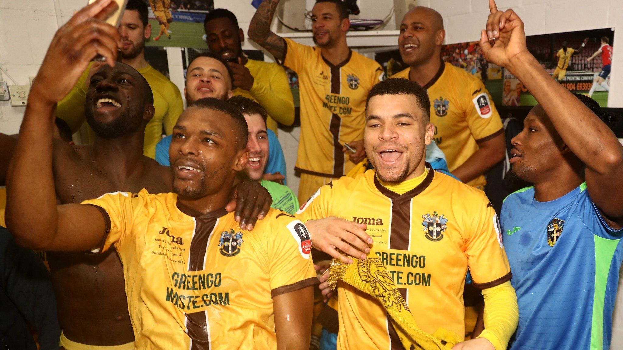 Sutton players celebrate their win in the changing room after The Emirates FA Cup Fourth Round match between Sutton United and Leeds United