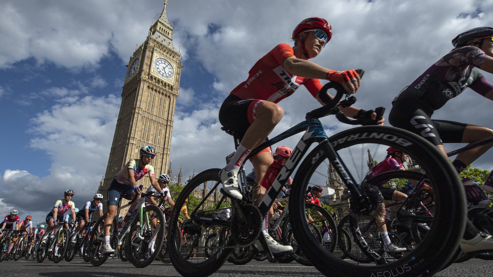 Cyclists ride past Big Ben during the 2022 Ride London Classique