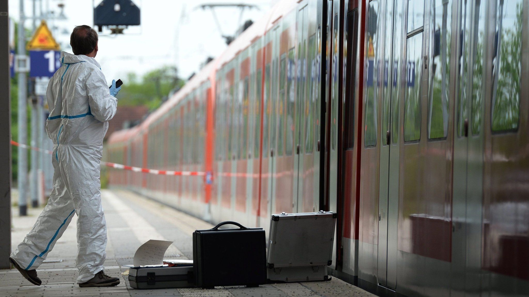 Forensic investigator at scene of attack on train at Grafing (10 May)