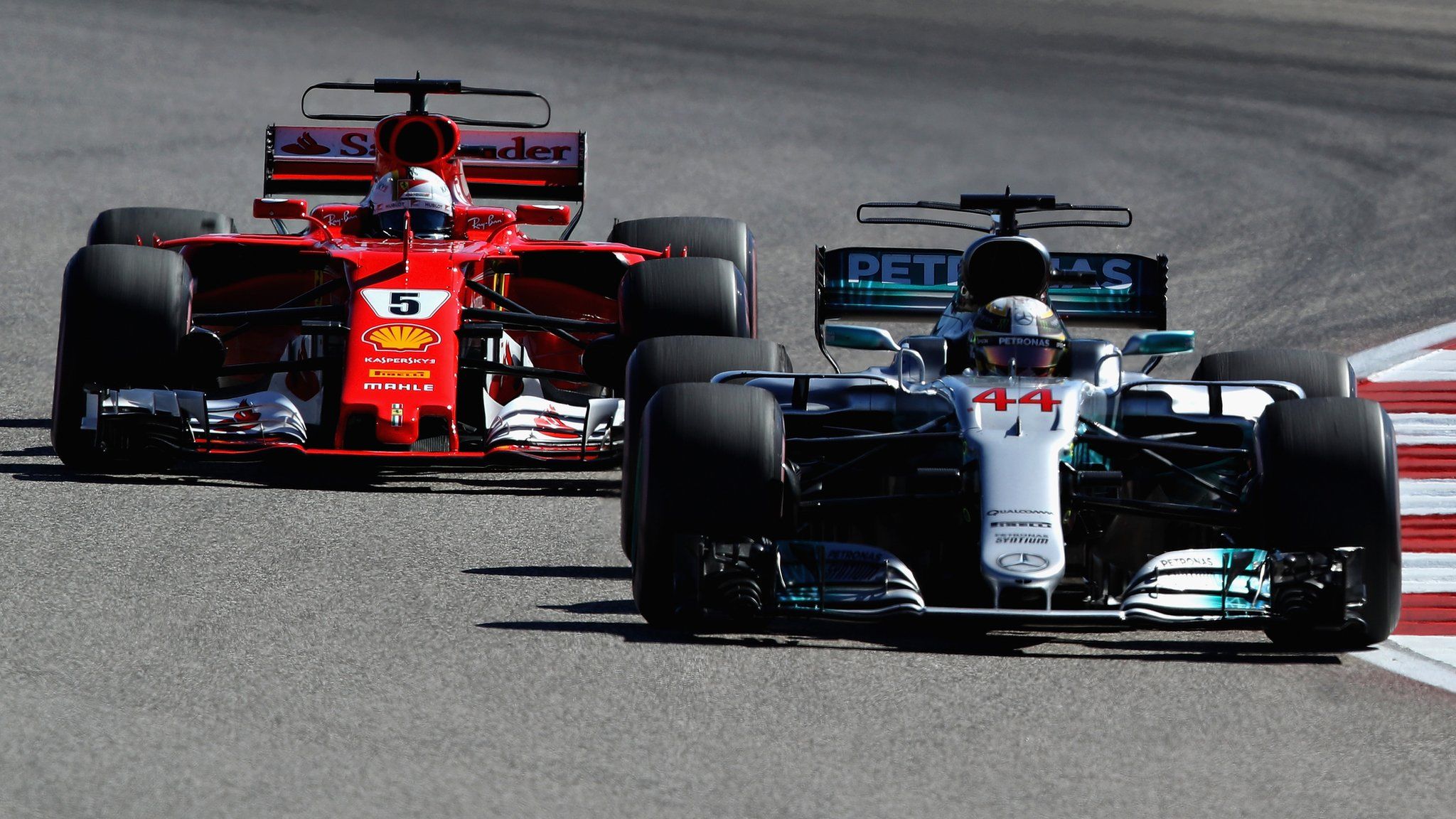 Mercedes and Ferrari Formula 1 teams in action during the 2017 United States Grand Prix