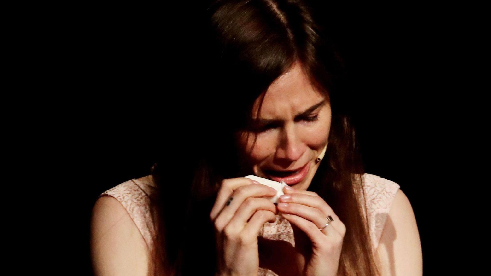 Amanda Knox cries as she attends the conference of the Criminal Justice Festival at the University of Modena, 15 June.
