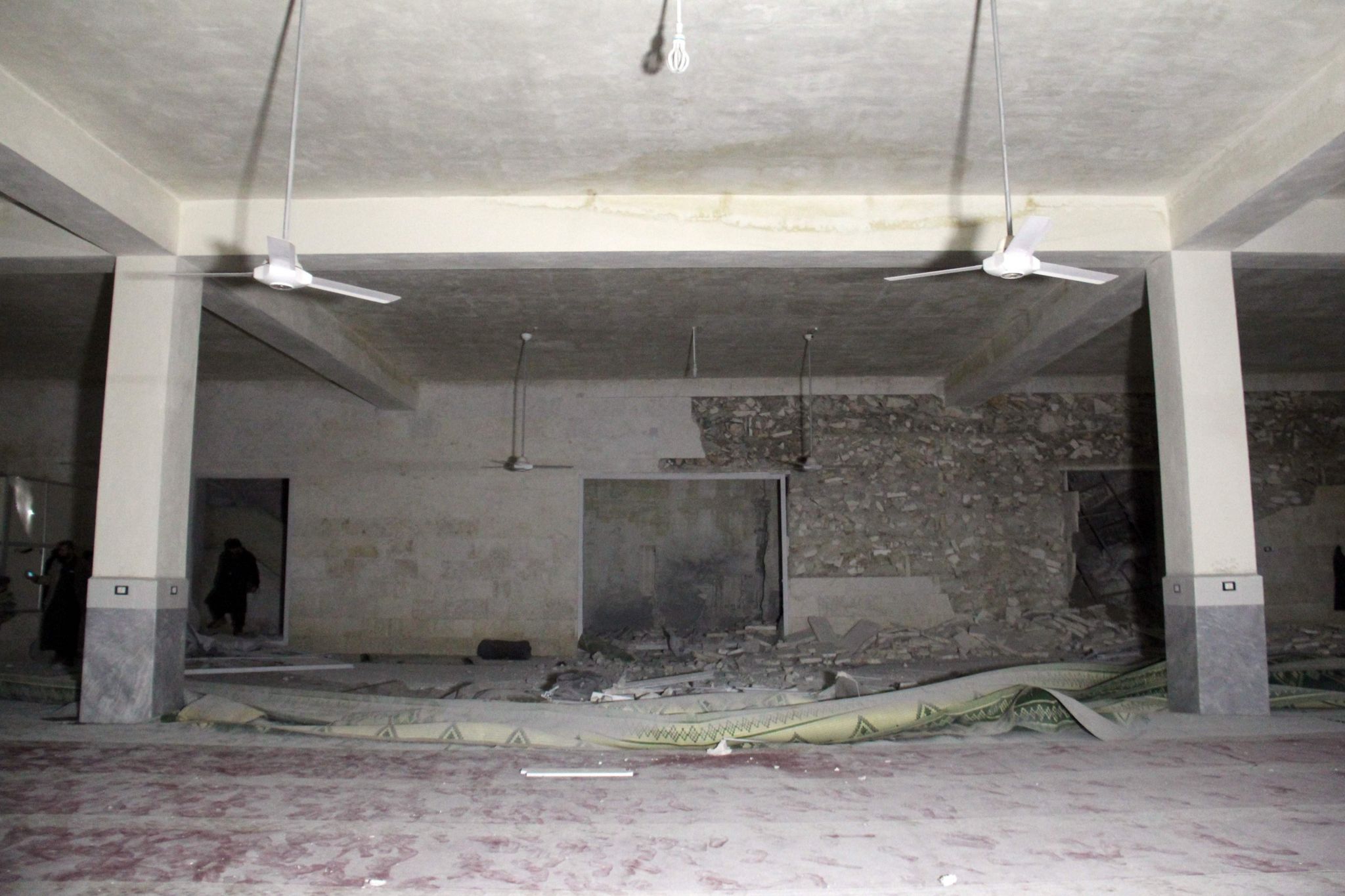 Damaged building, apparently a Muslim prayer hall, at site of al-Jineh air strike