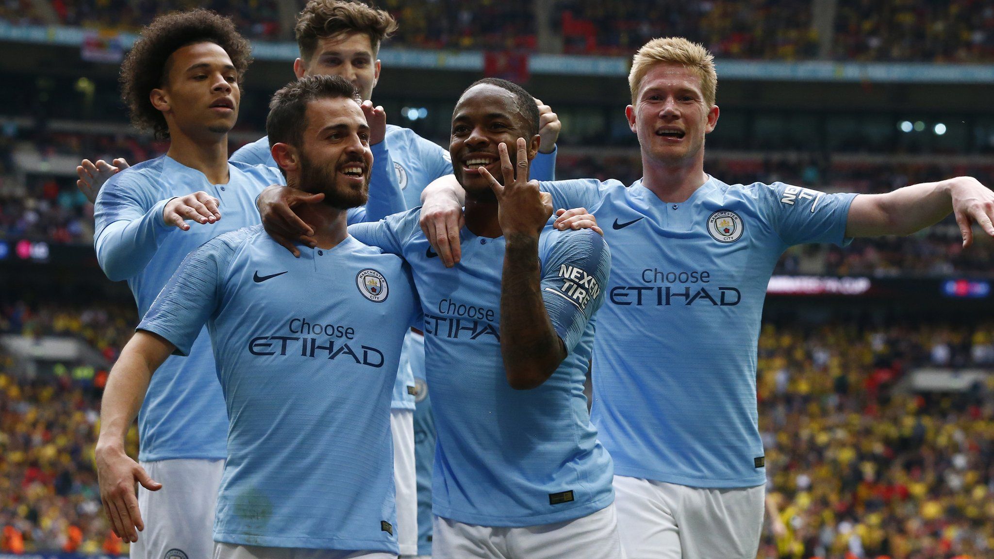Manchester City players celebrate winning the FA Cup