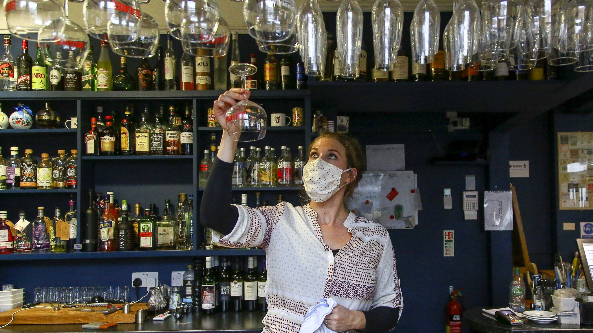 Co-owner of the Banc pub, Holly Adams-Evans, works behind the bar in Knighton