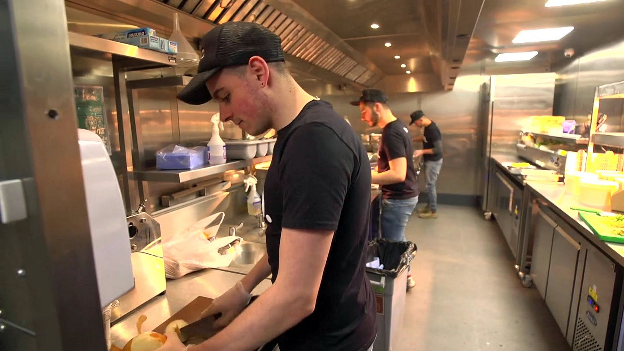 workers in a Deliveroo kitchen