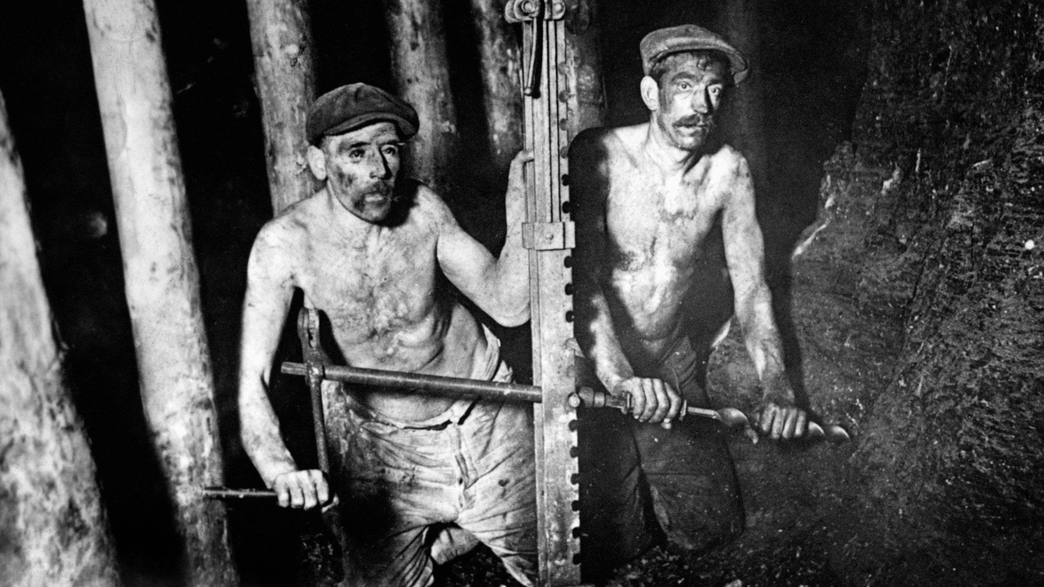 Two miners digging coal in 1924