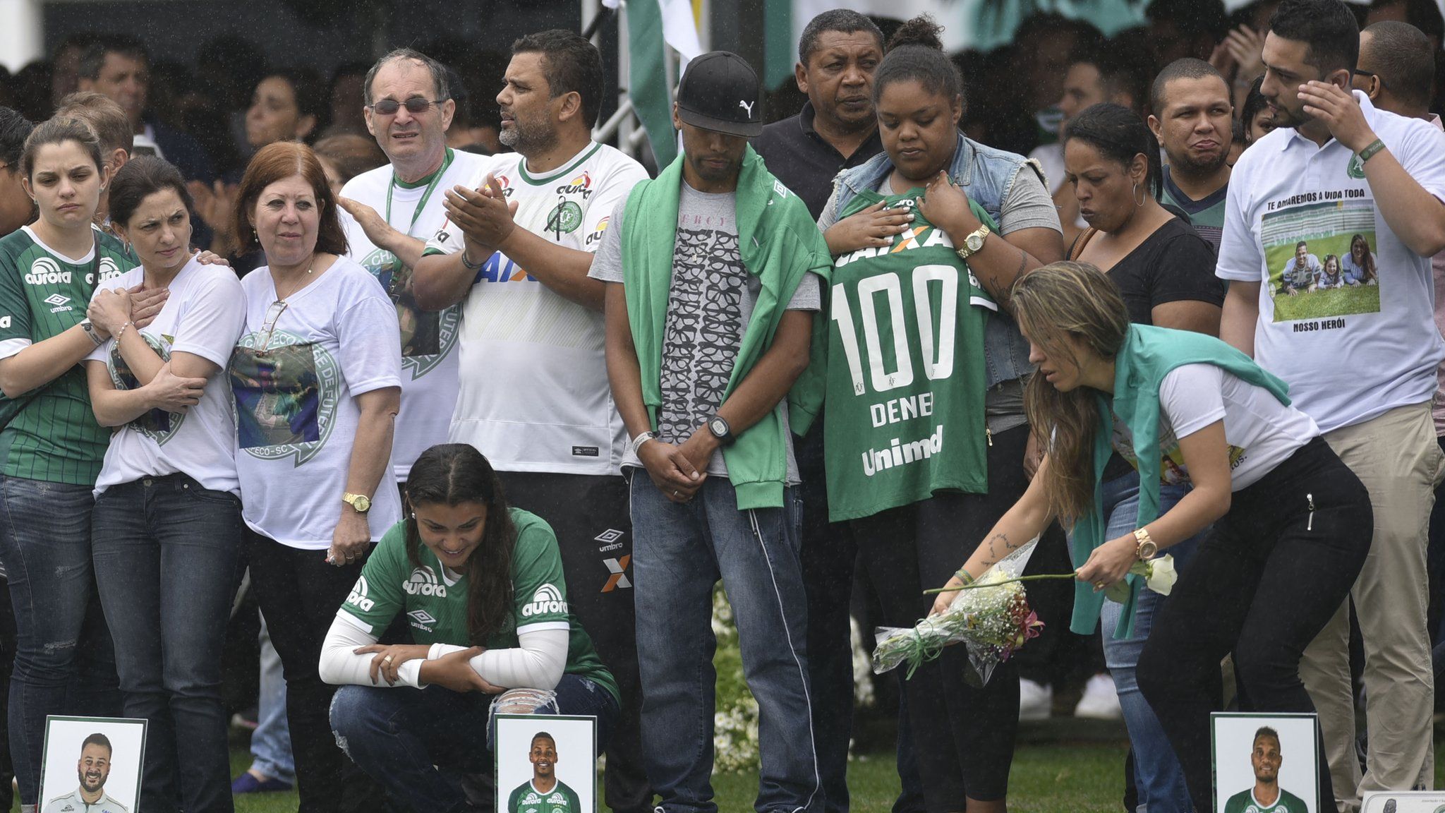 Supporters and families pay tribute to the deceased