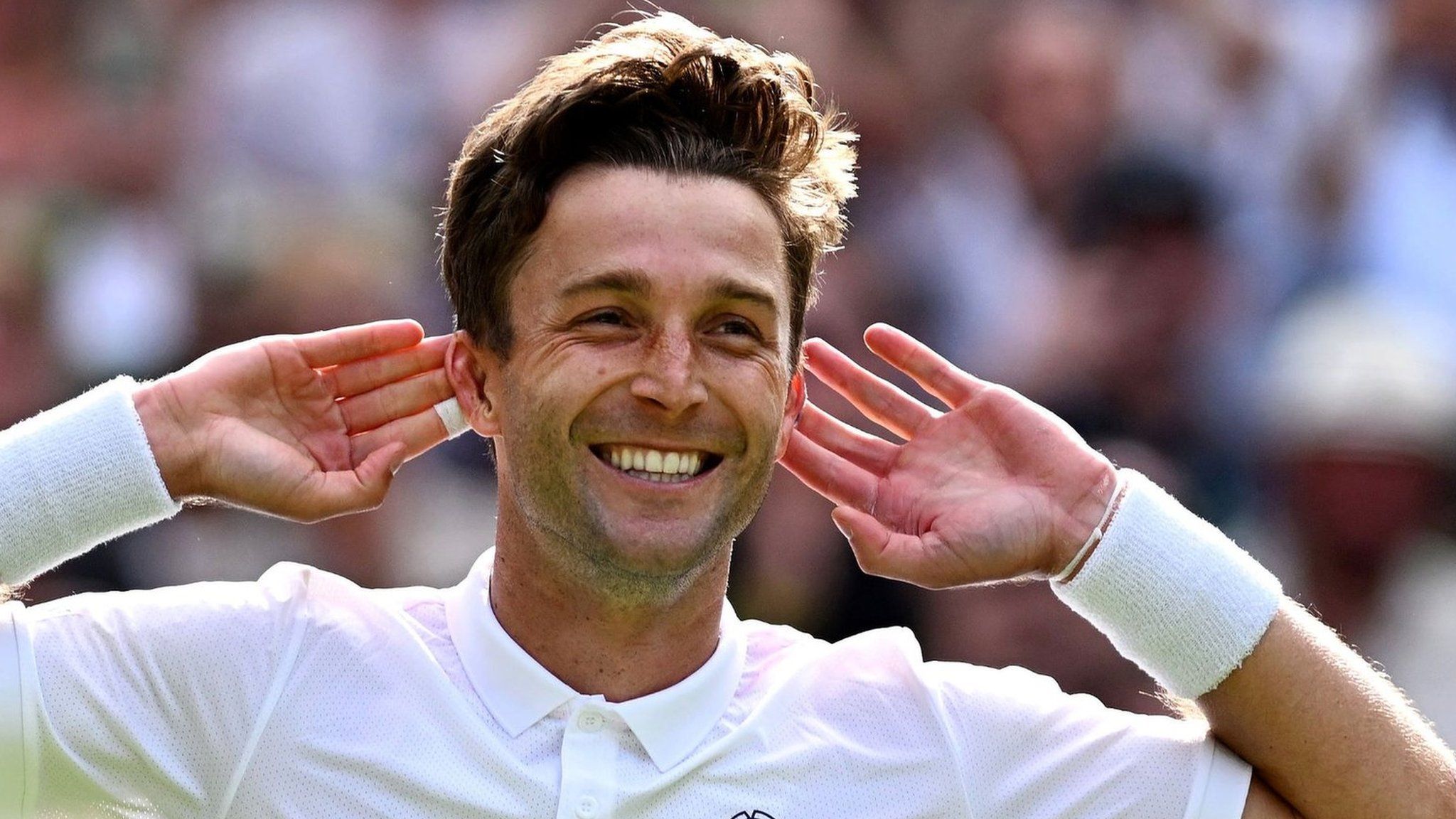 Liam Broady celebrates at Wimbledon