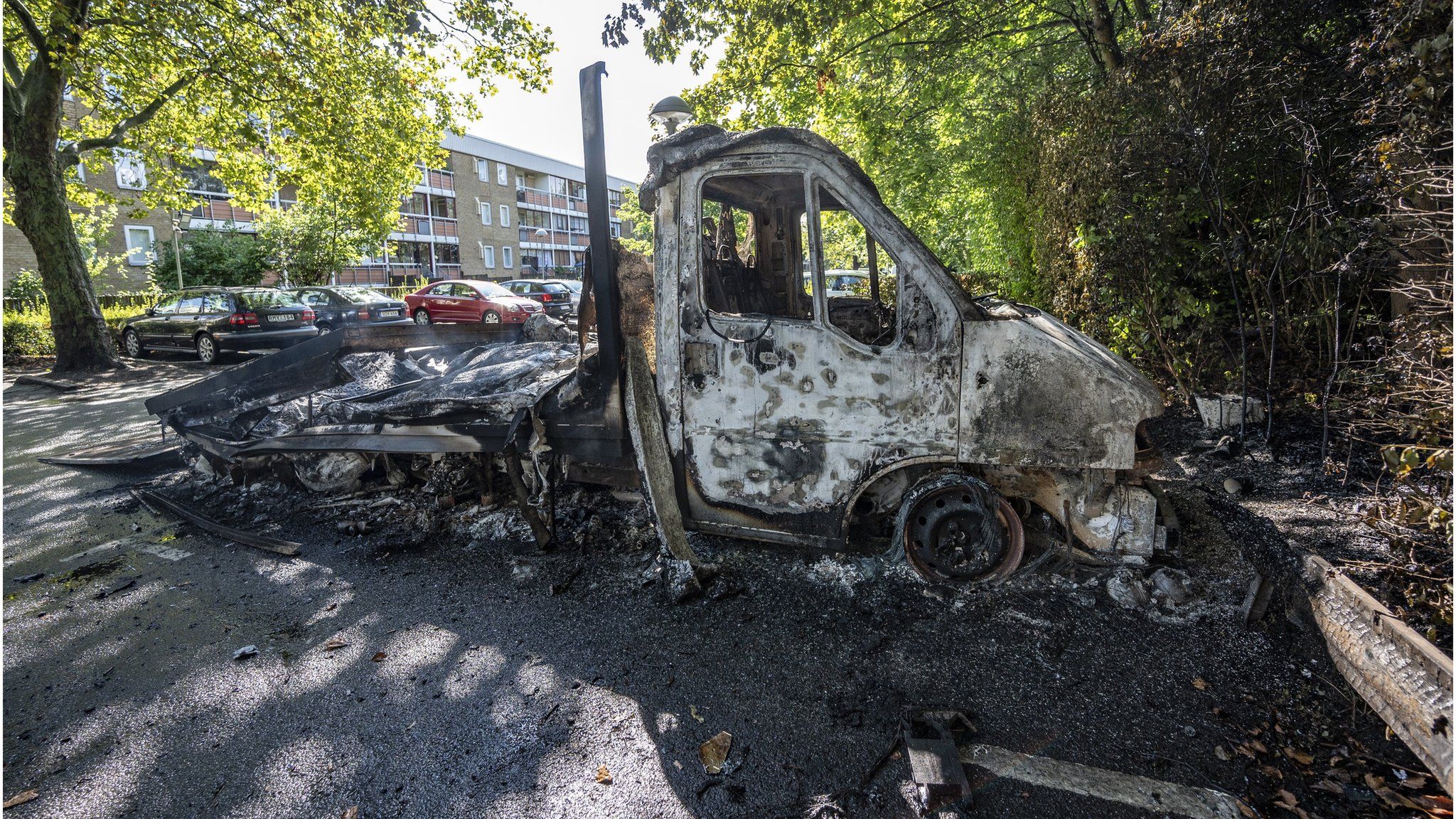 A burnt out light truck pictured a day after the riot in the Rosengard neighbourhood of Malmo, Sweden, 29 August 2020.