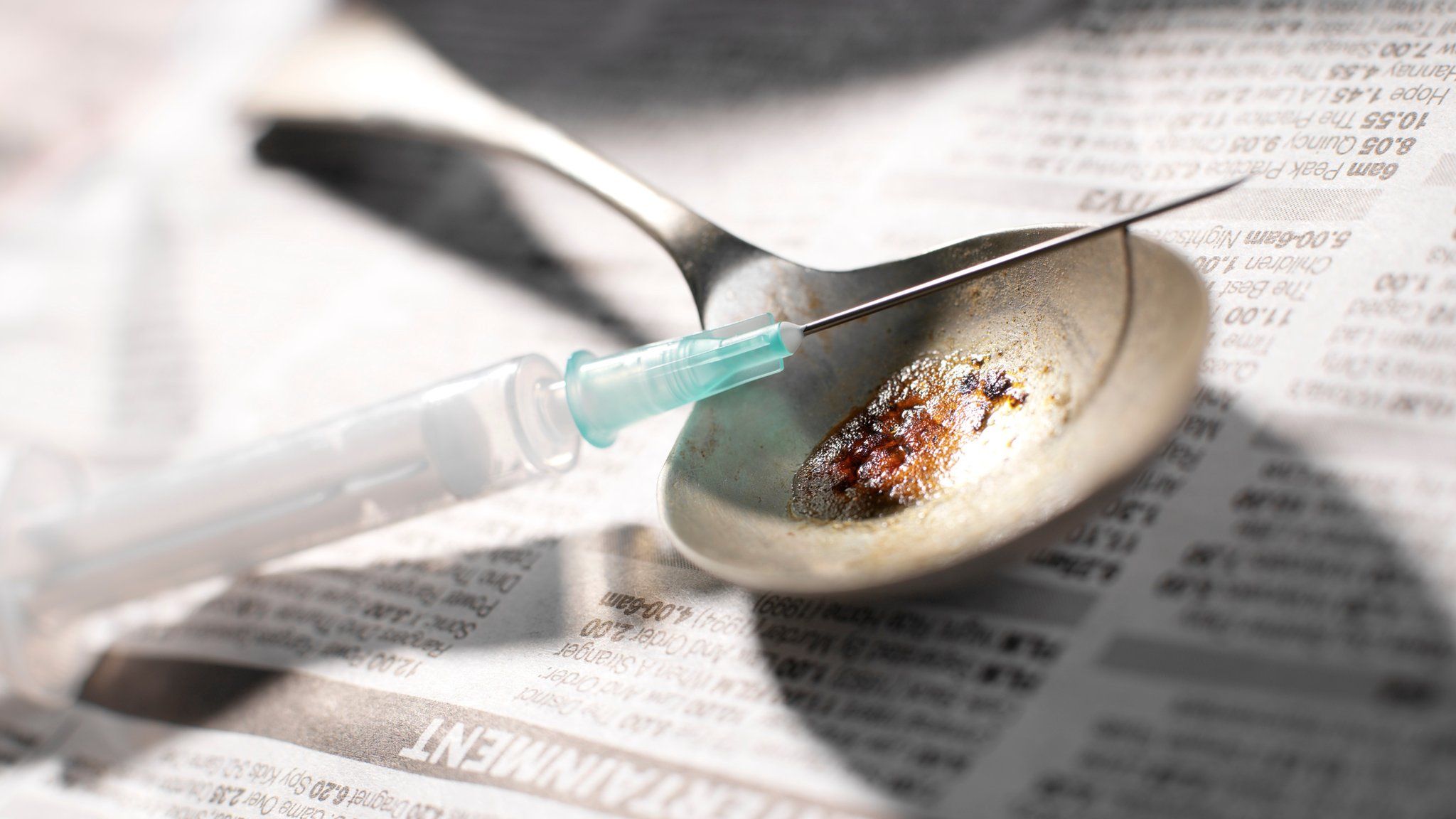 A needle and spoon containing heroin