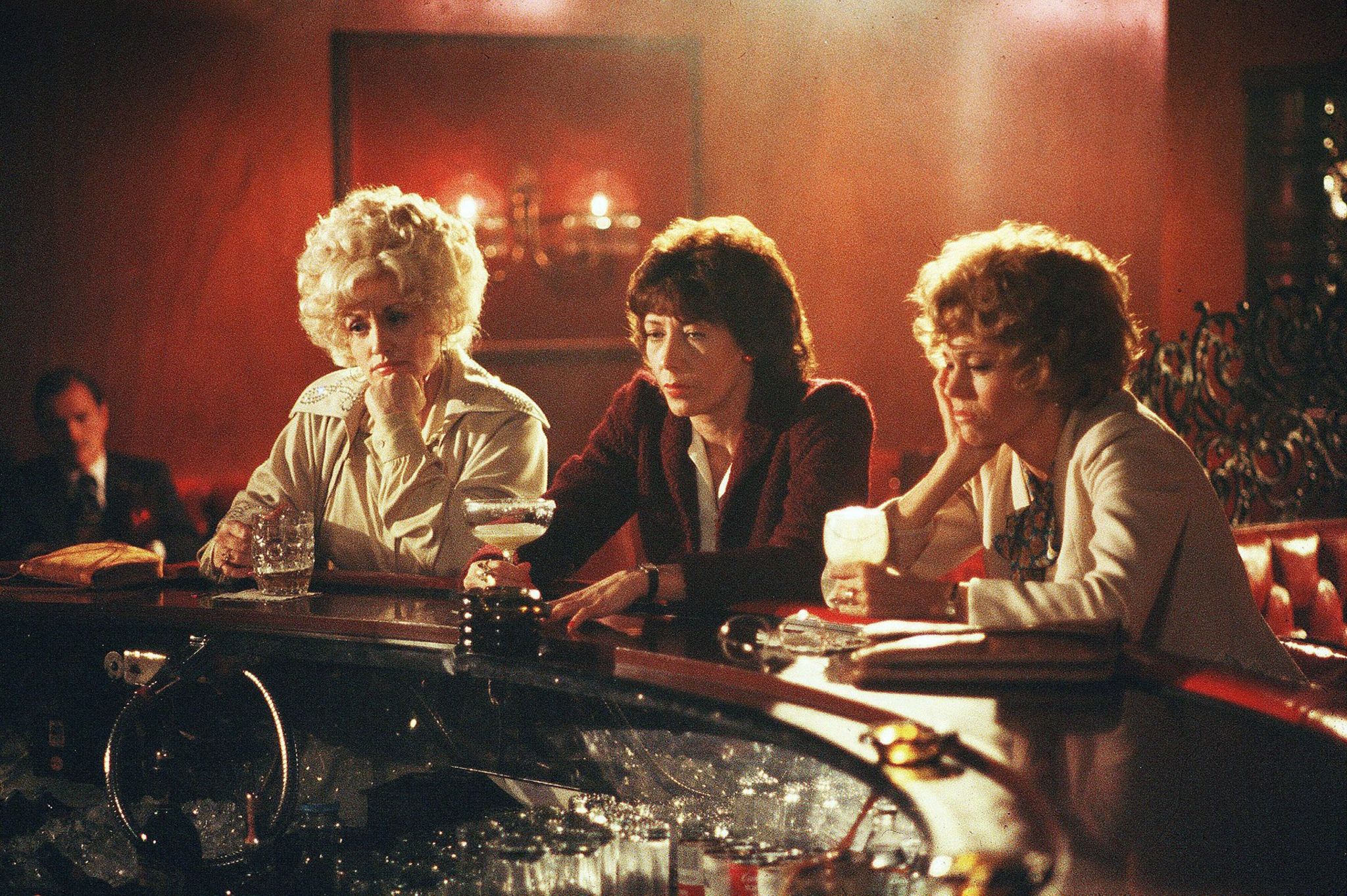 Dolly Parton, Lily Tomlin and Jane Fonda drown their sorrows in a scene from 9 to 5