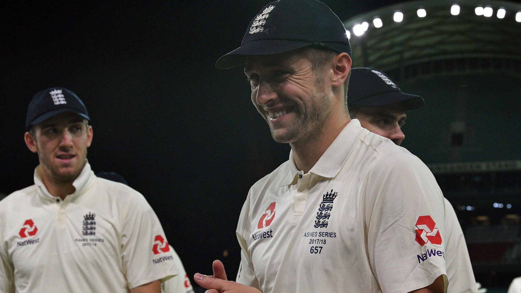 Chris Woakes walks off smiling at the end of the third day
