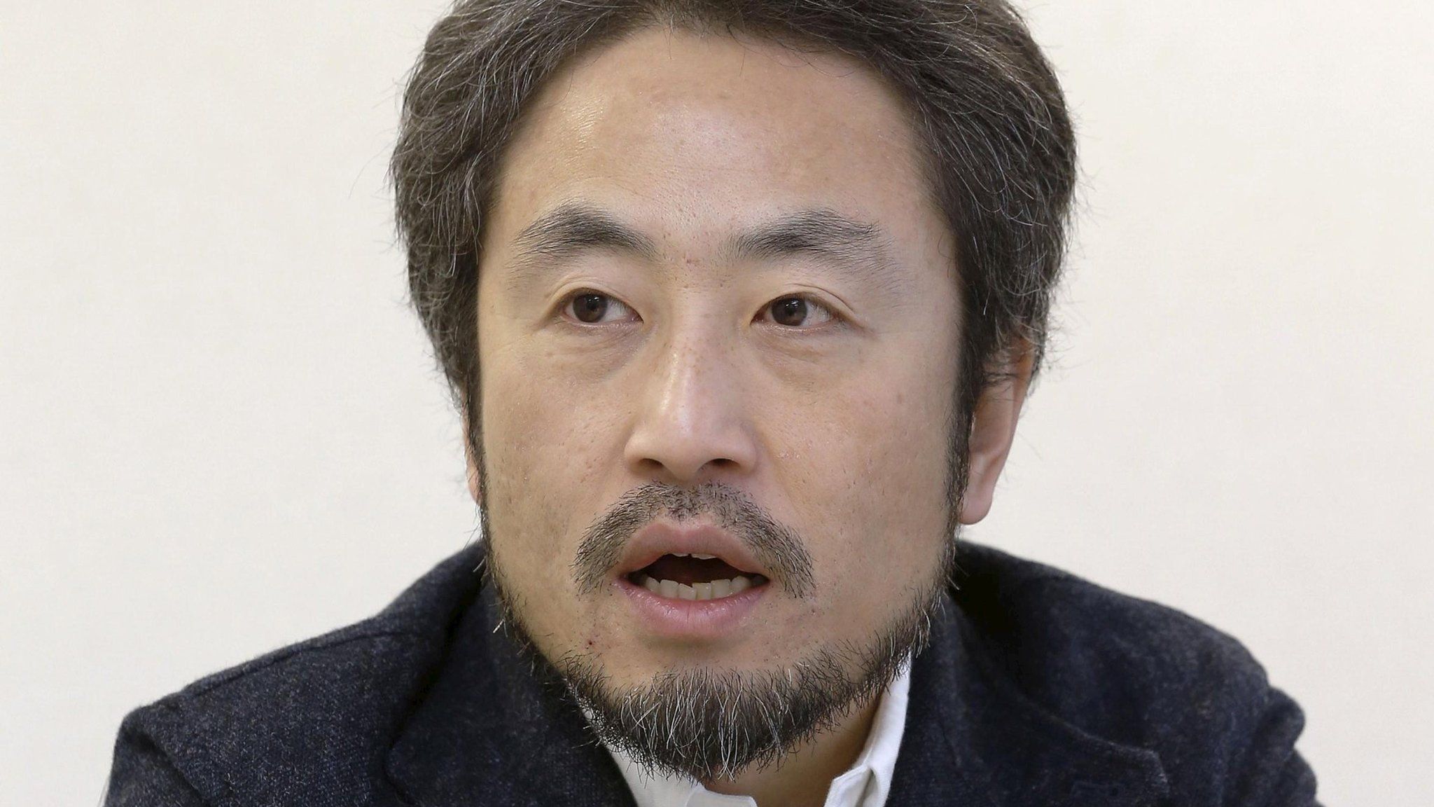 Japanese journalist Yasuda Jumpei speaks during an interview in Tokyo, in this photo taken by Kyodo in February 2015