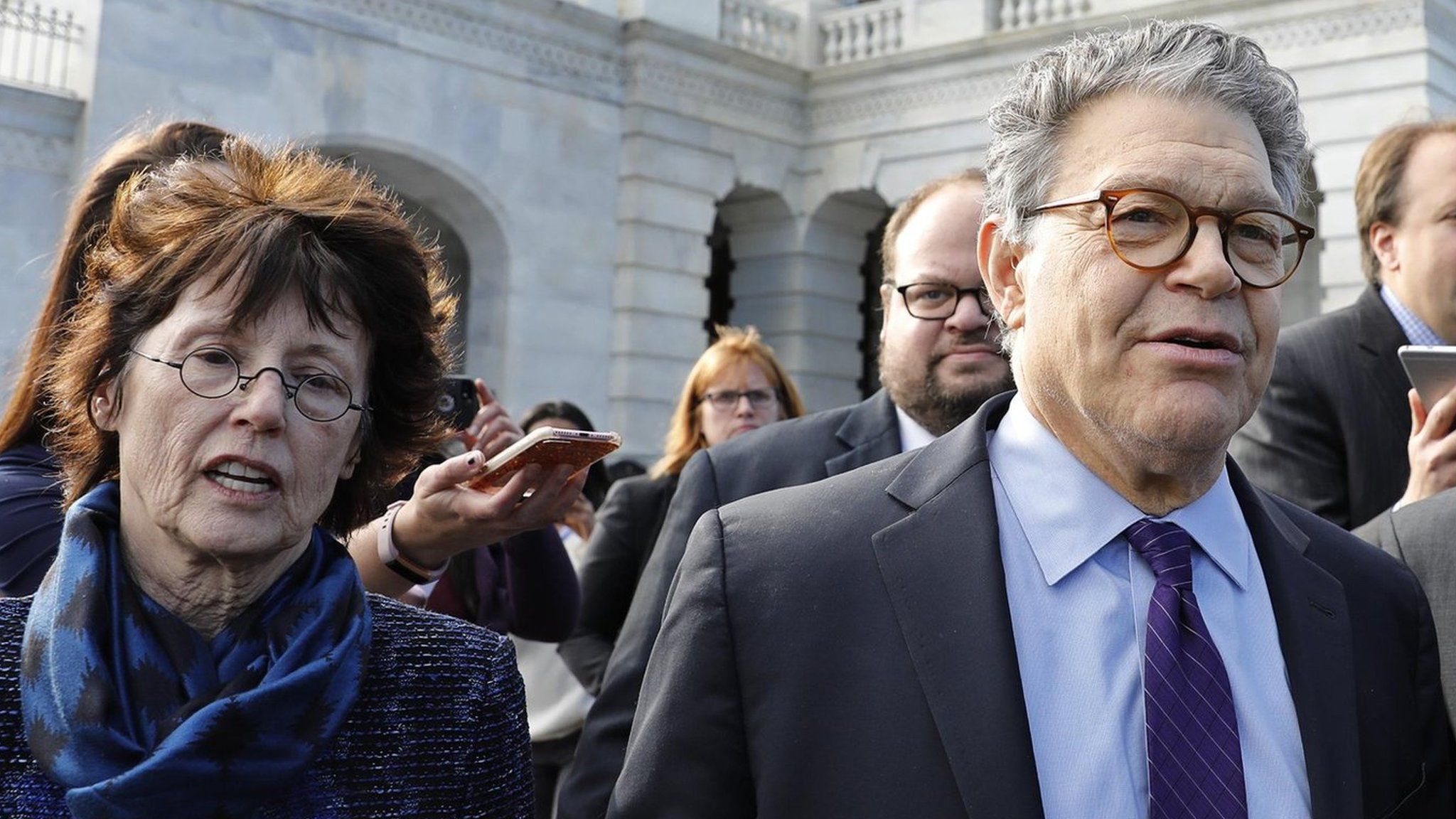 Senator Al Franken departs the Capitol with his wife Franni