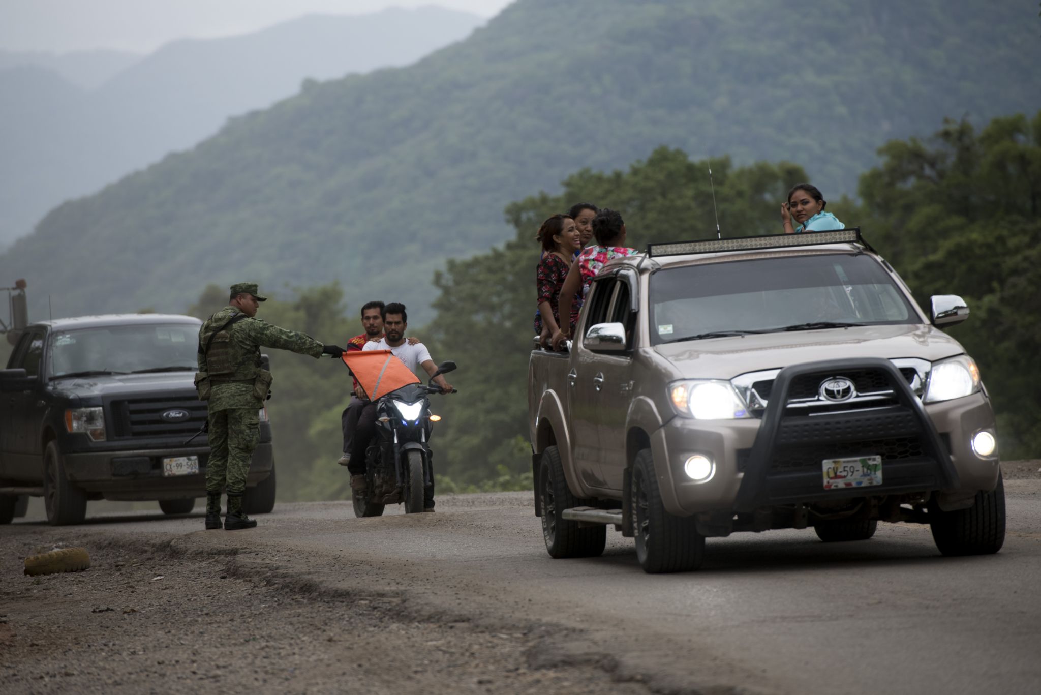 Migrants at a checkpoint by Mexican security forces in southern Mexico