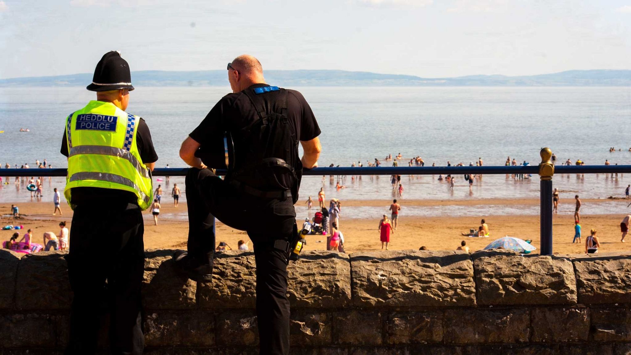 police officers overlooking beach