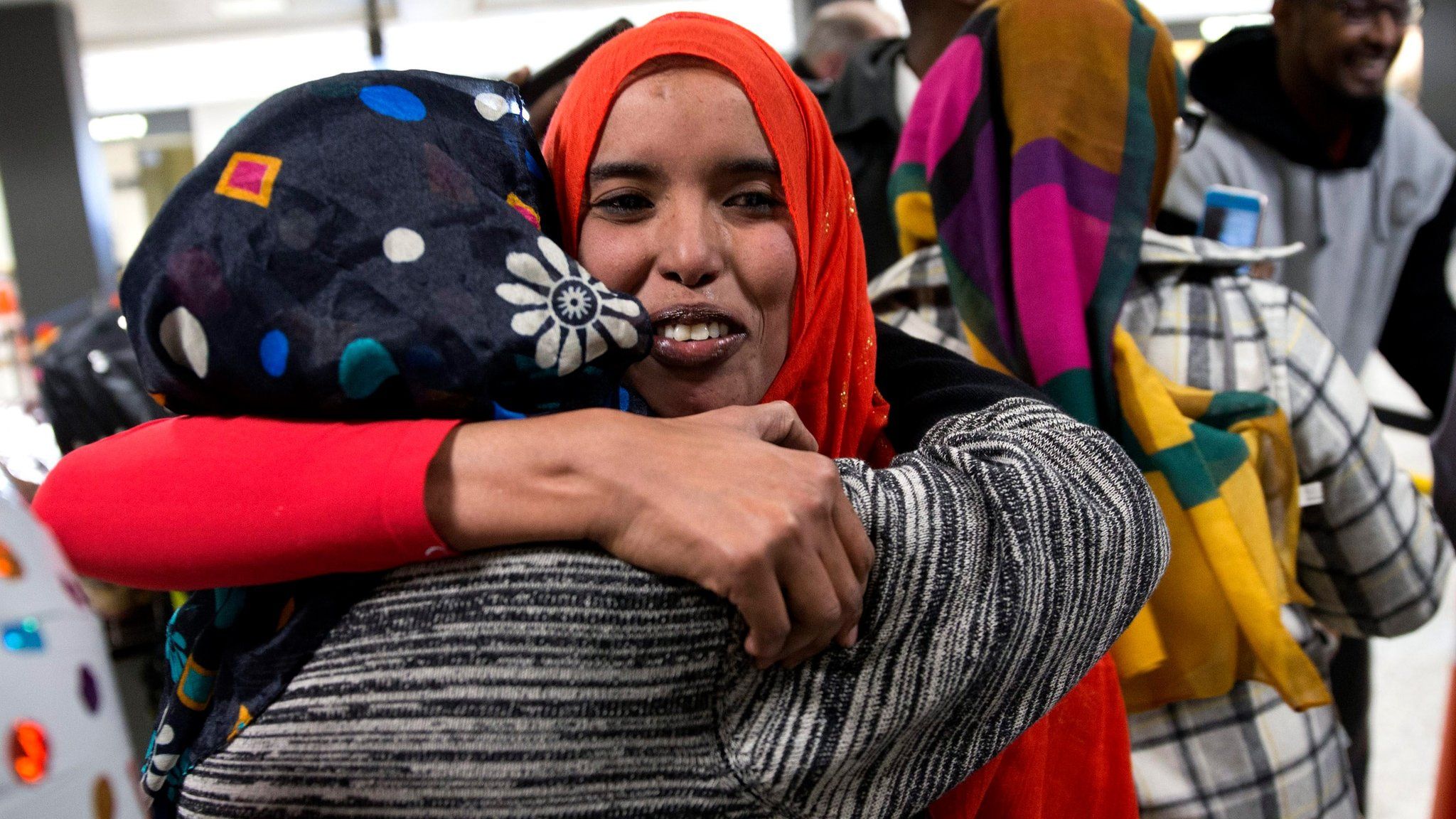 Zaura Warsma (L) welcomes her daughter Najma Abdishakur (R), a Somali national who was denied entry under the Trump administration travel ban, after she cleared customs at Washington Dulles International Airport in Chantilly, Virginia, USA, 06 February 2017.