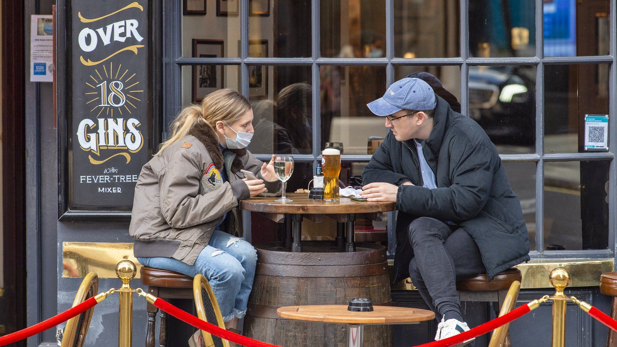 People sitting outside the Cock and Lion pub in Marylebone in December 2020