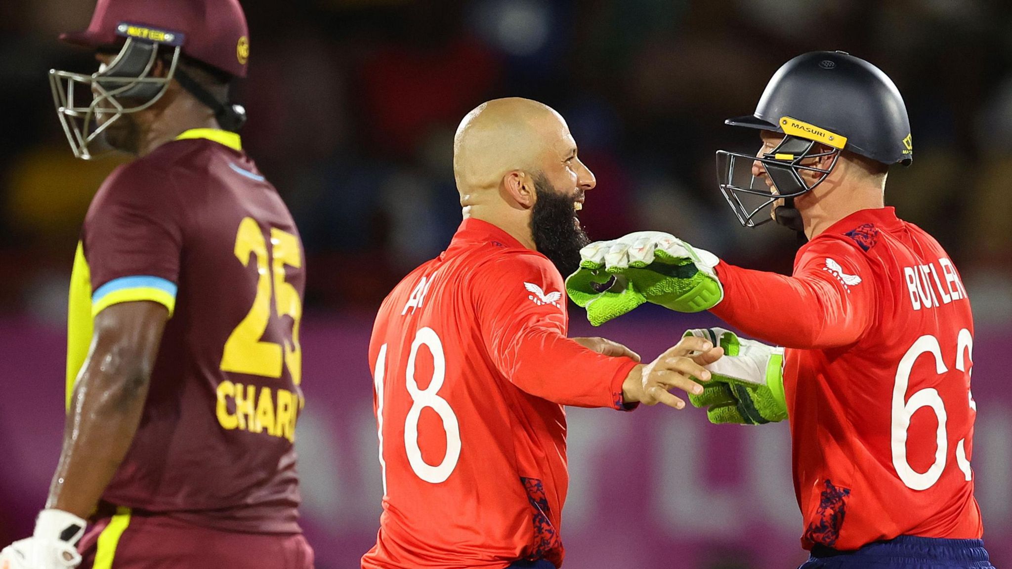 Moeen Ali and Jos Buttler celebrate wicket