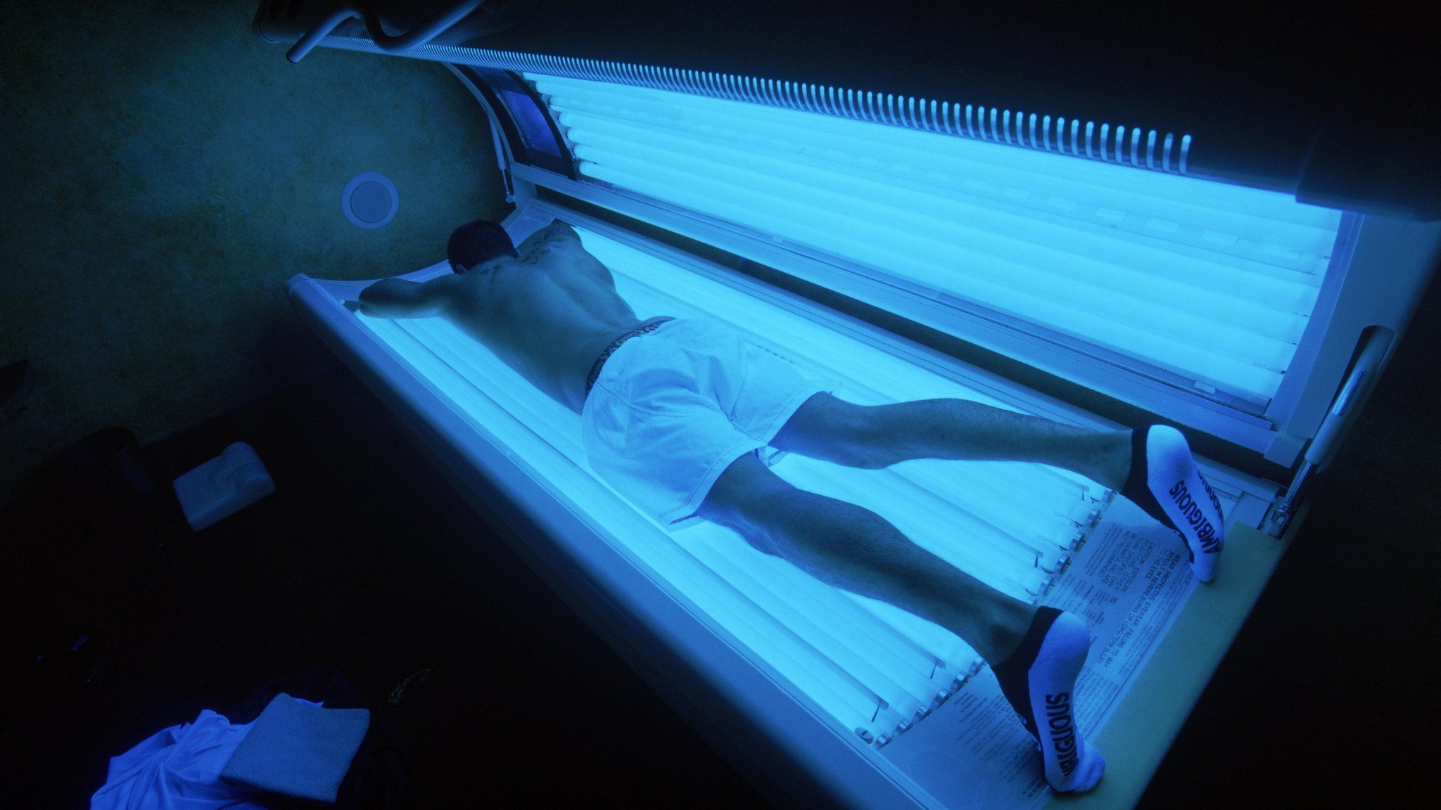 Man on a tanning bed