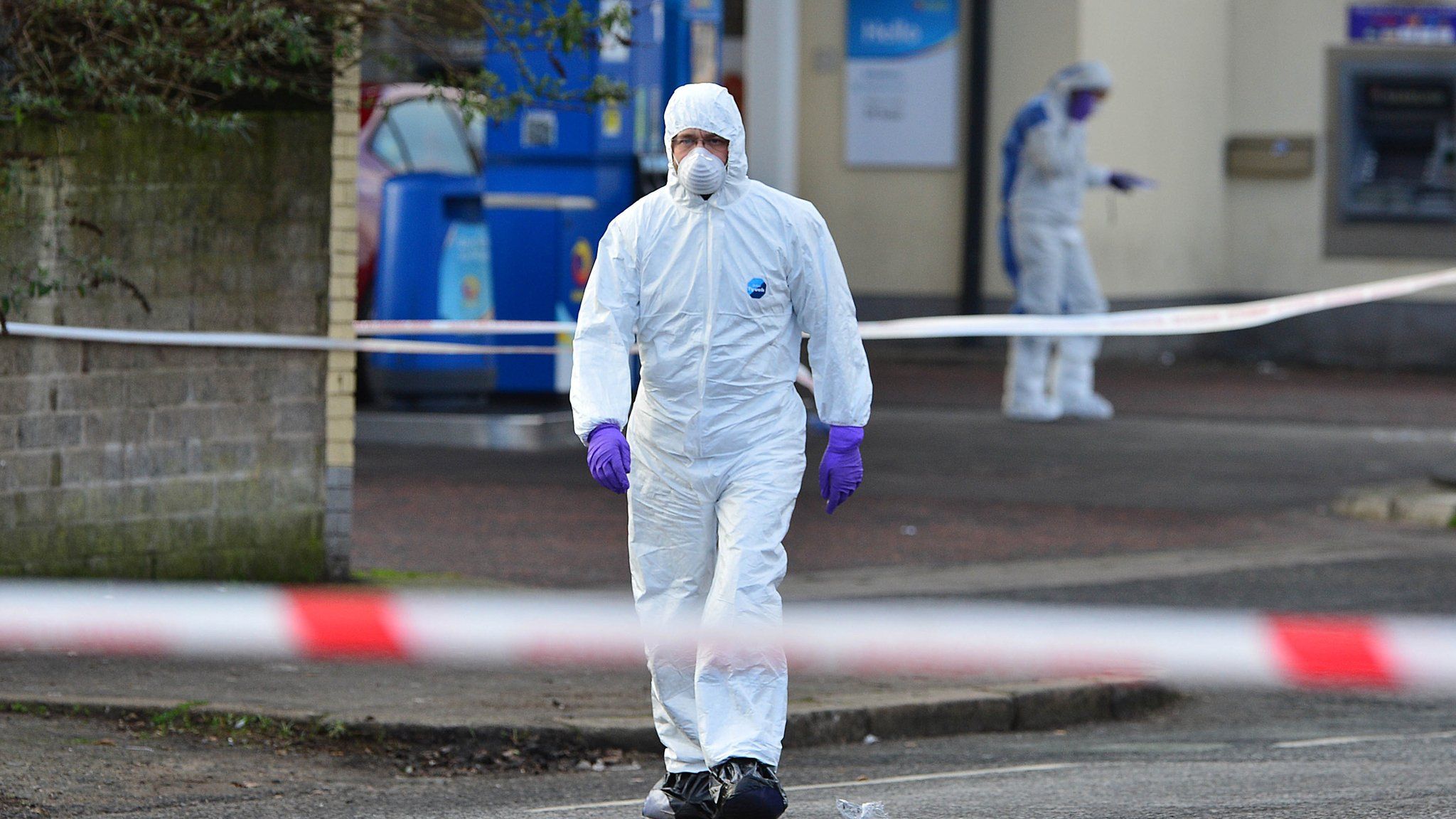 Forensic officers at the scene of the Crumlin Road shooting