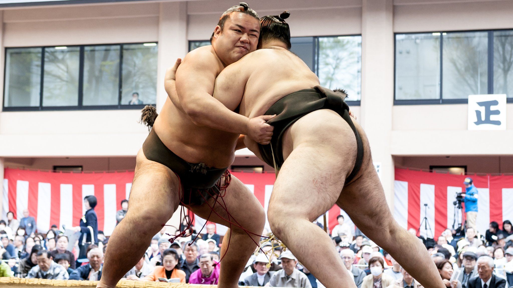 Two men sumo wrestling