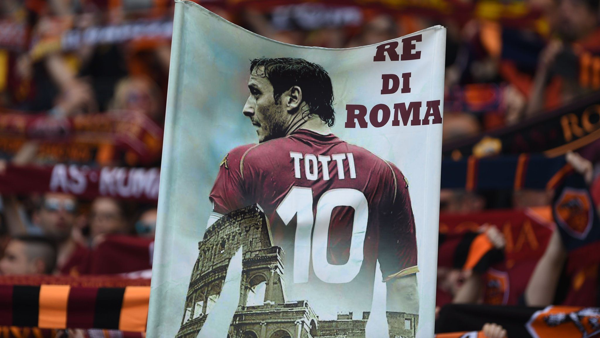 Roma fans hold up a banner in support of captain and striker Francesco Totti