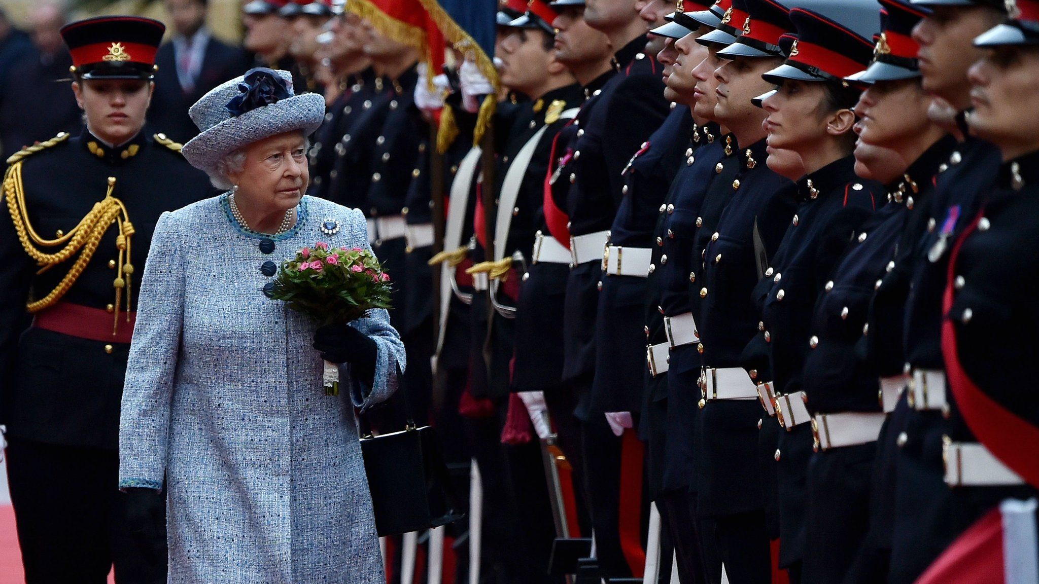Queen Elizabeth II inspecting a Maltese guard of honour
