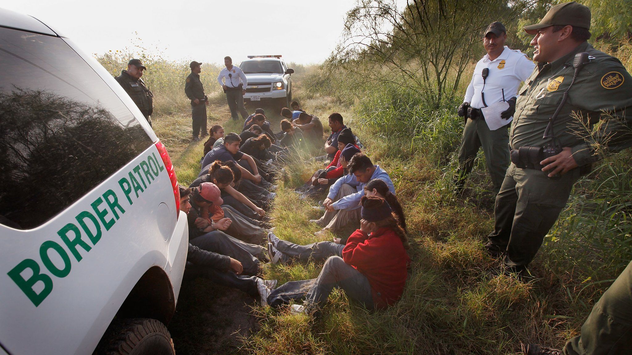 Border Patrol agents detain undocumented immigrants apprehended along the Mexican border near McAllen, Texas, on 28 May 28, 2010