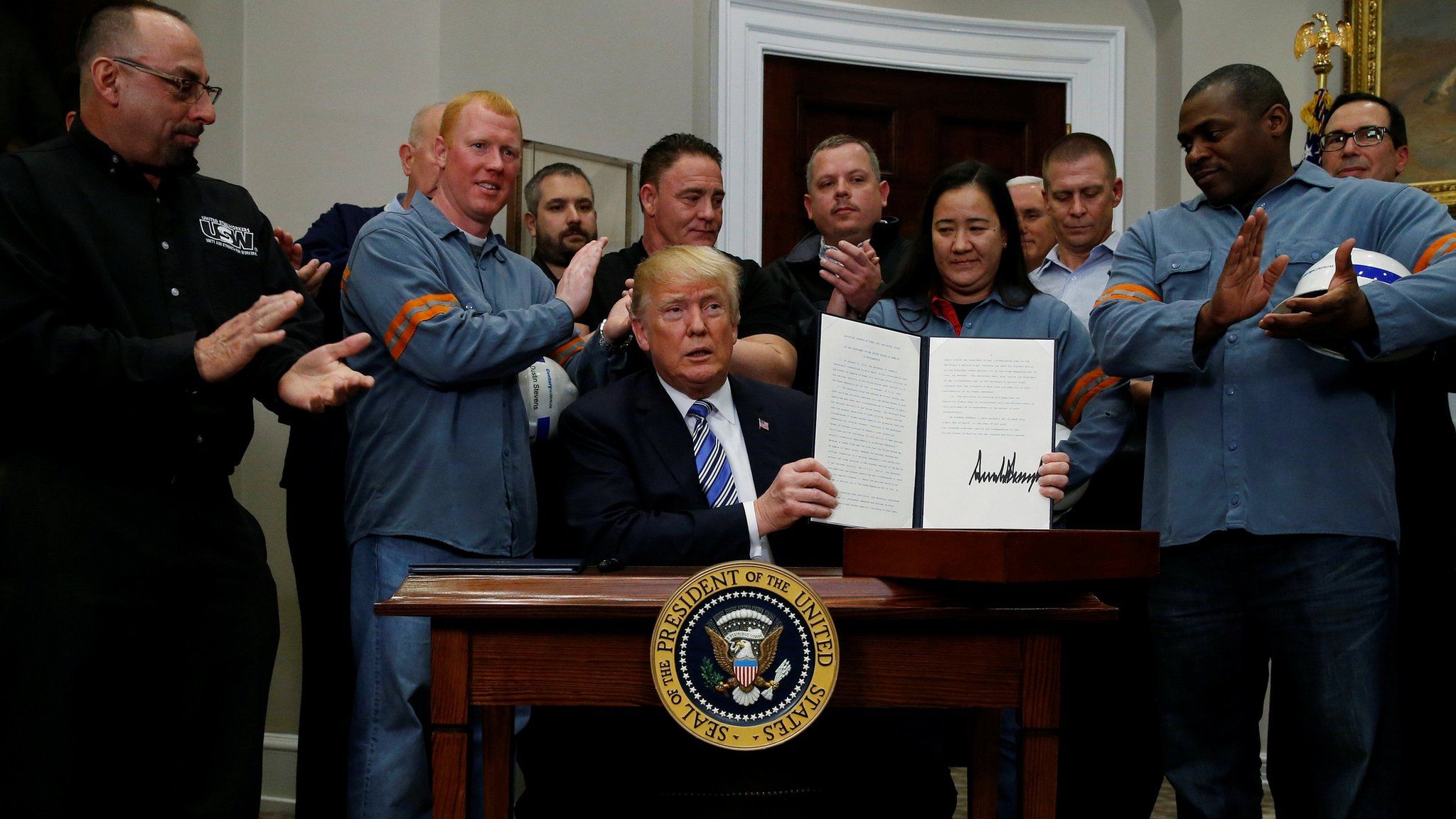 President Donald Trump signs a proclamation to establish tariffs on imports of steel and aluminium at the White House. March 8, 2018