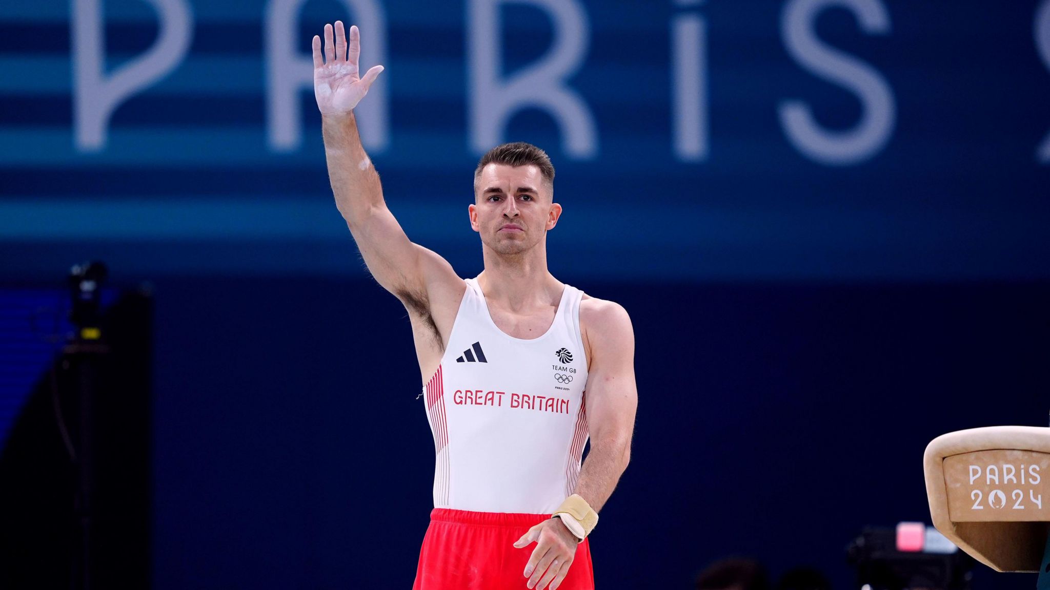 Max Whitlock waving at the crowd while at the Olympics held in Paris 2024.