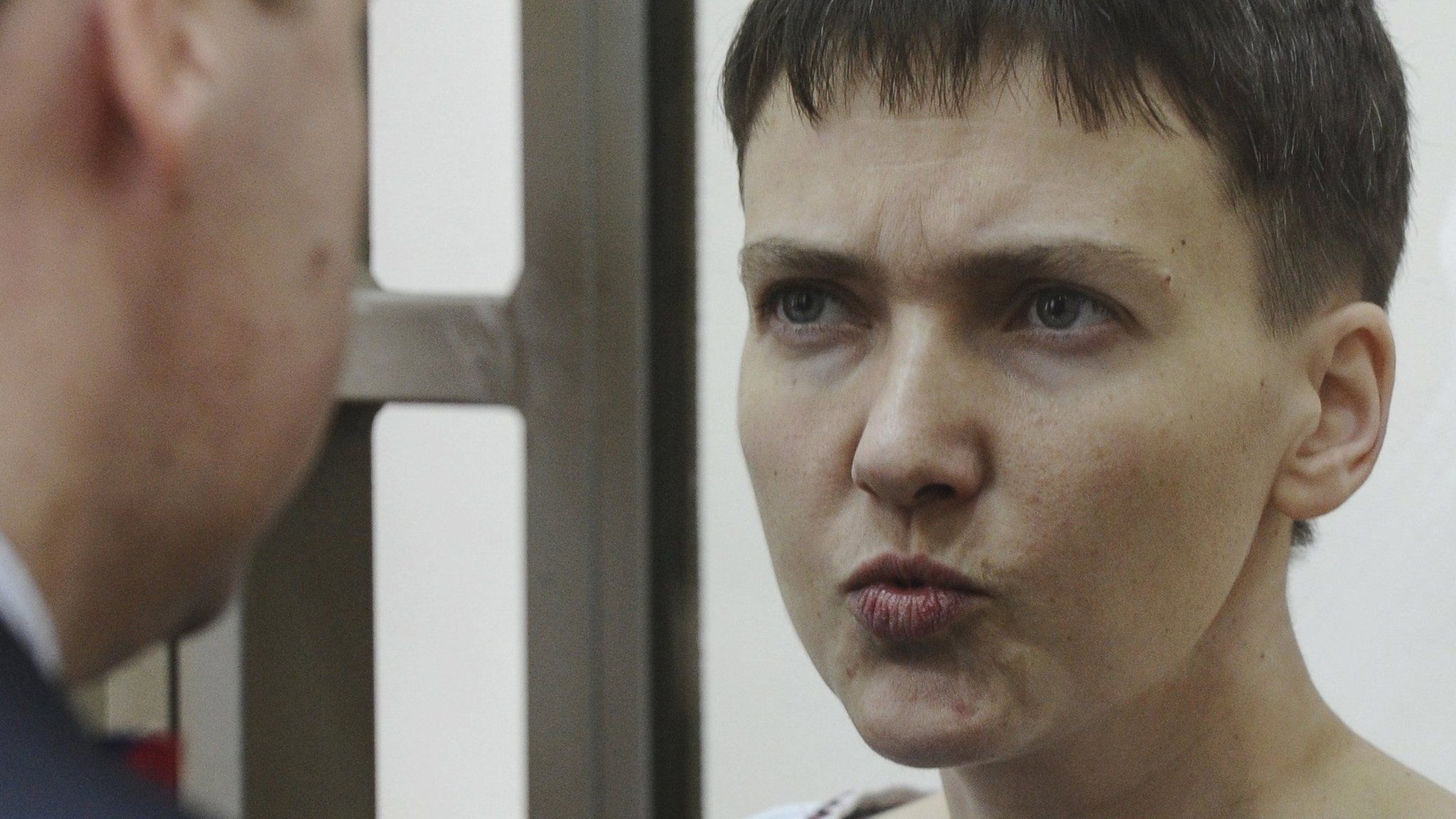 Ukrainian army pilot Nadia Savchenko talks to her lawyer Ilya Novikov from glass-walled cage in court hearing in town of Donetsk in Rostov region, Russia, March 3, 2016
